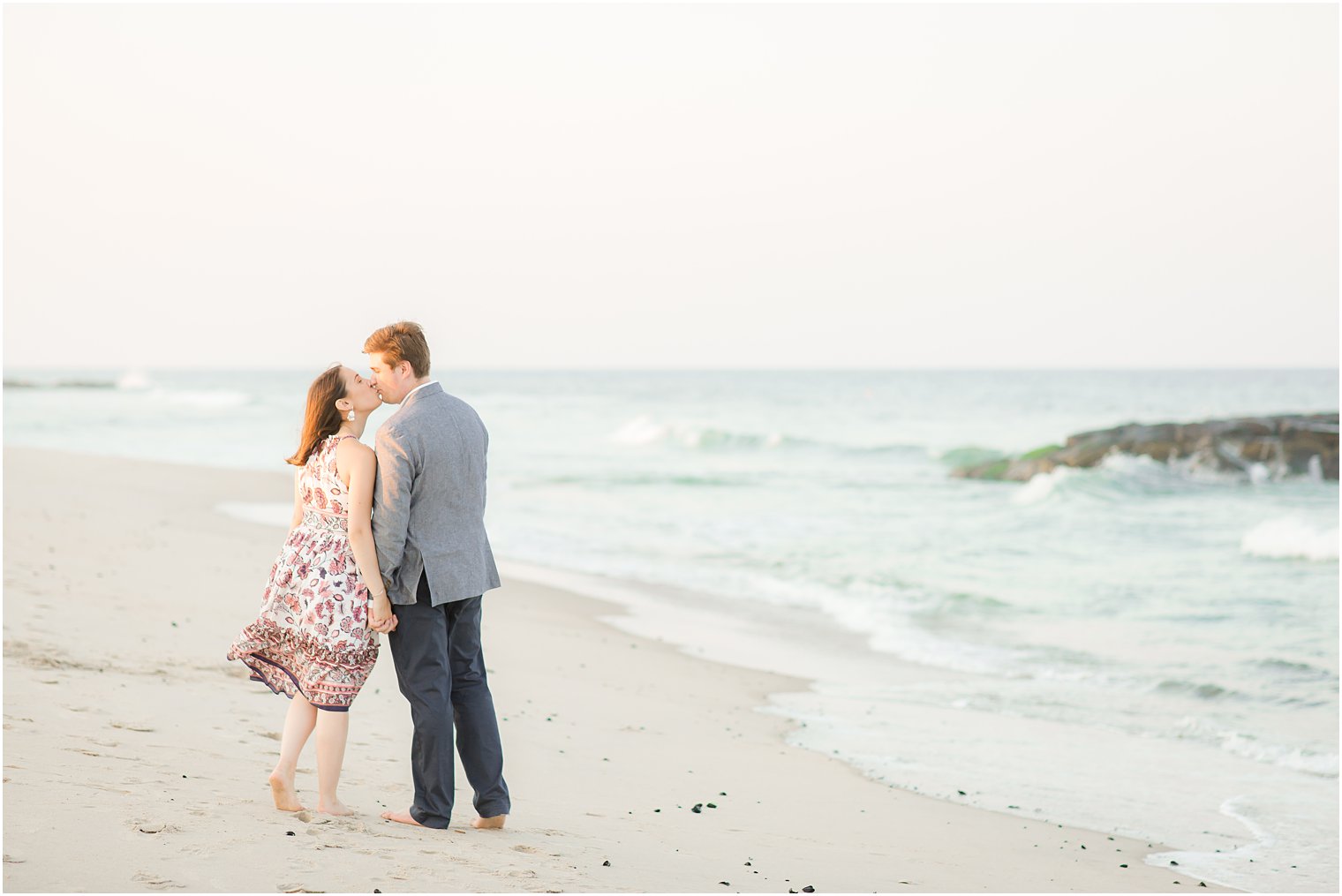 Couple kissing on a beach in Spring Lake