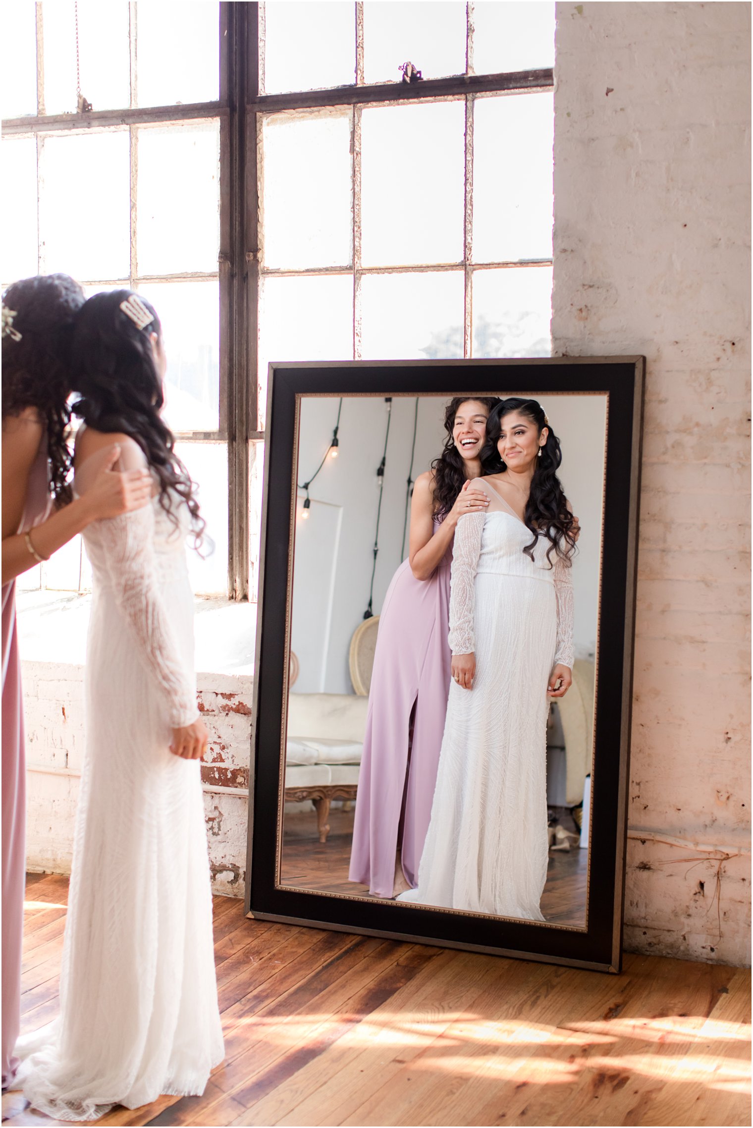 Bride getting ready with her maid of honor at Art Factory Studios in Paterson, NJ