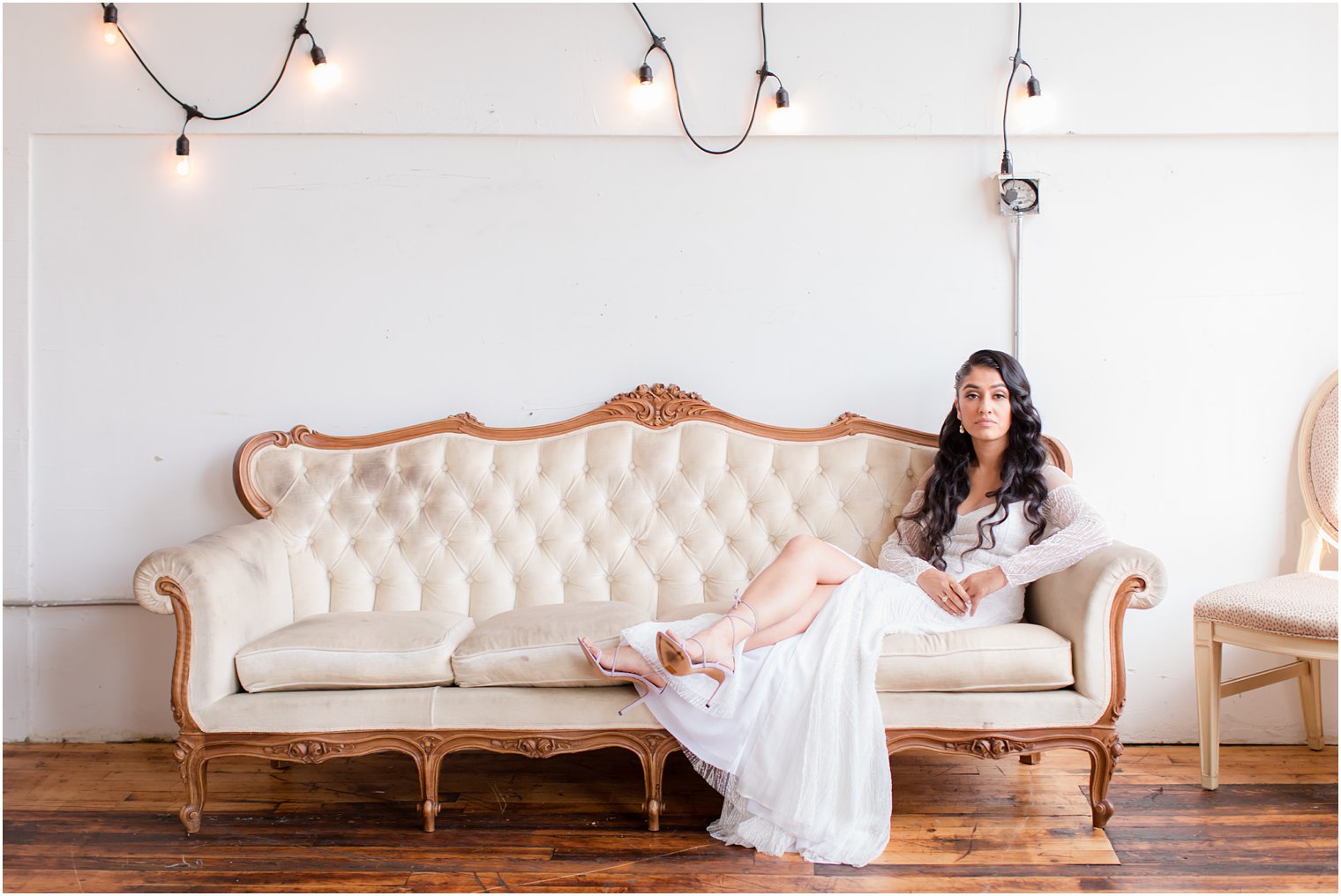 Bride sitting on a couch at Art Factory Studios in Paterson, NJ