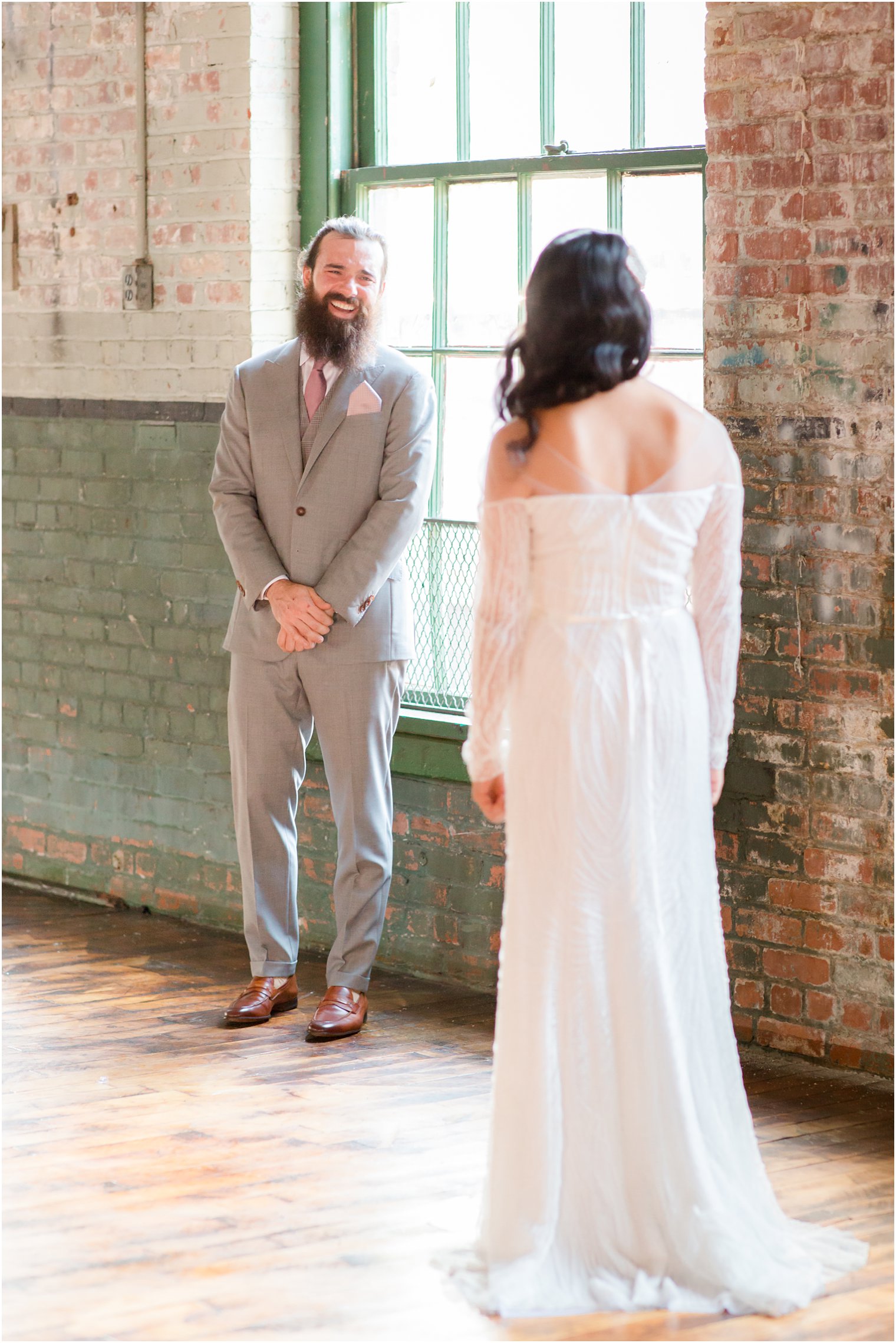 Groom and bride share a first look at Art Factory Studios in Paterson, NJ