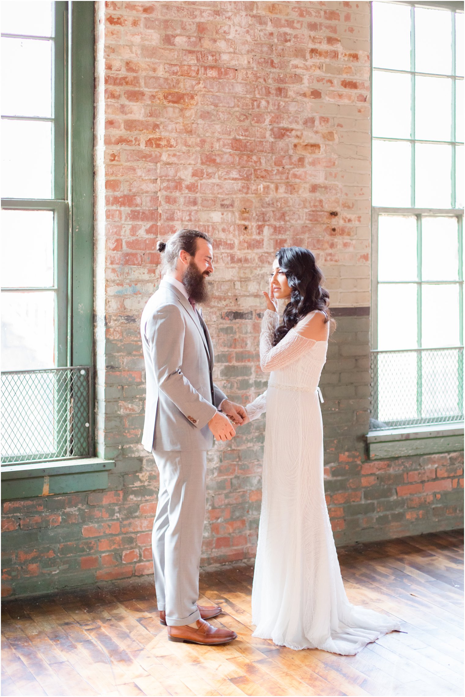 Bride and groom sharing a tearful first look