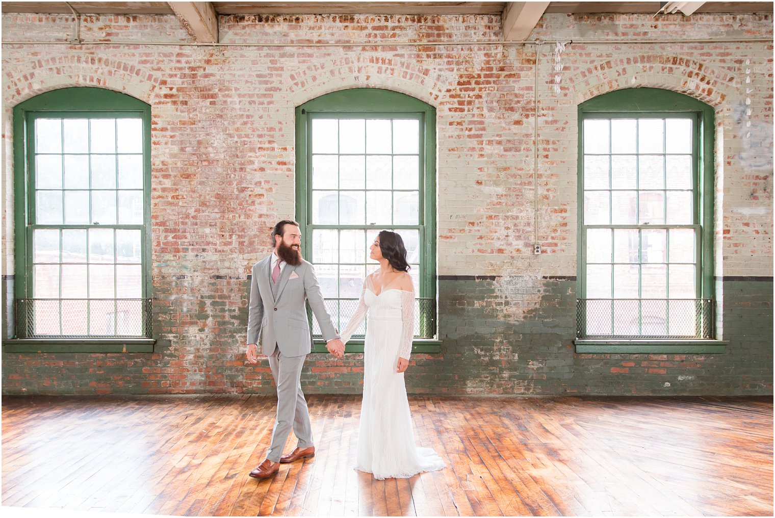 Bride and groom walking at Art Factory Studios in Paterson, NJ