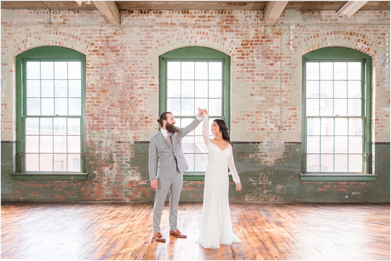 Candid photo of bride and groom dancing