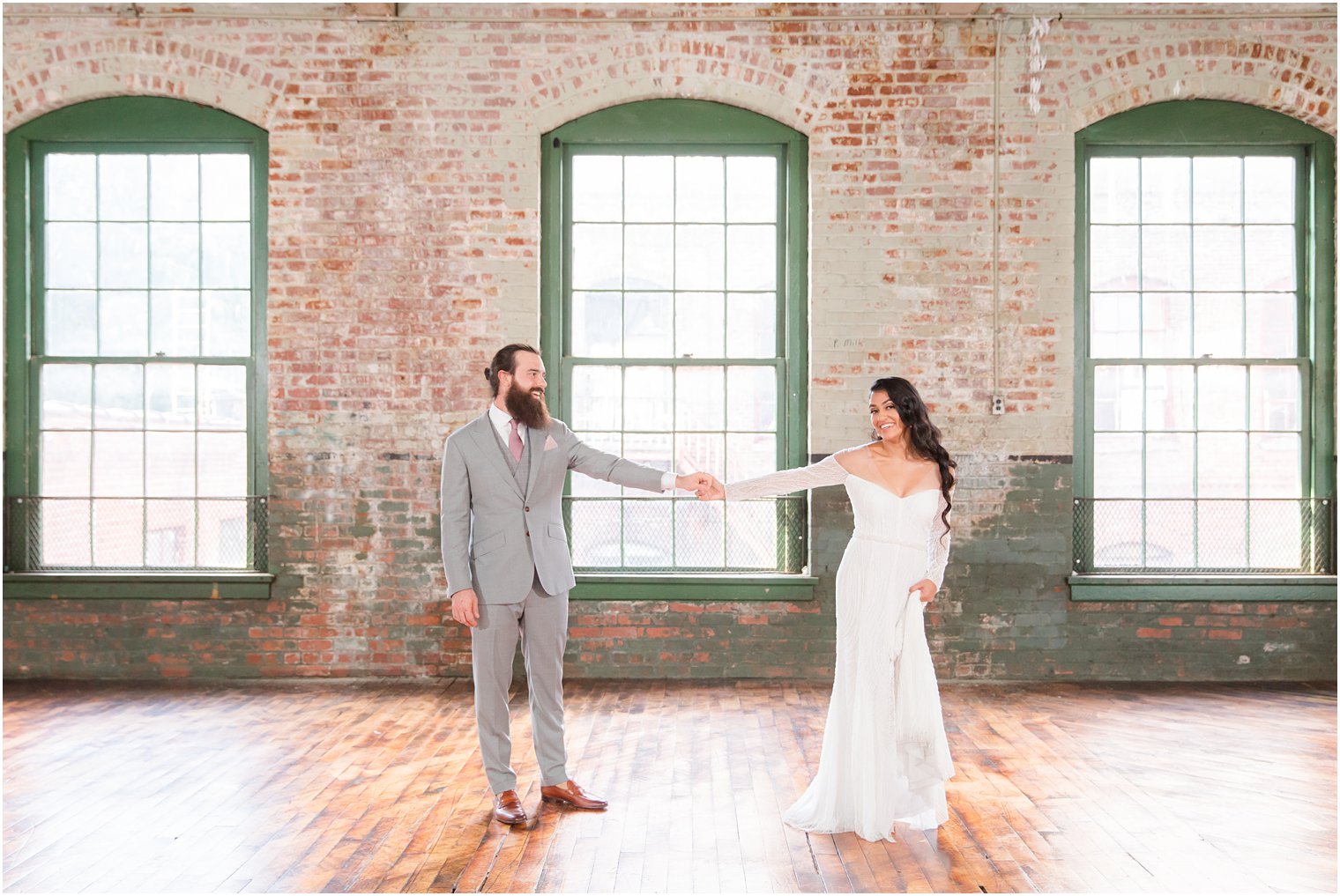 Bride and groom dancing in empty room at Art Factory Studios