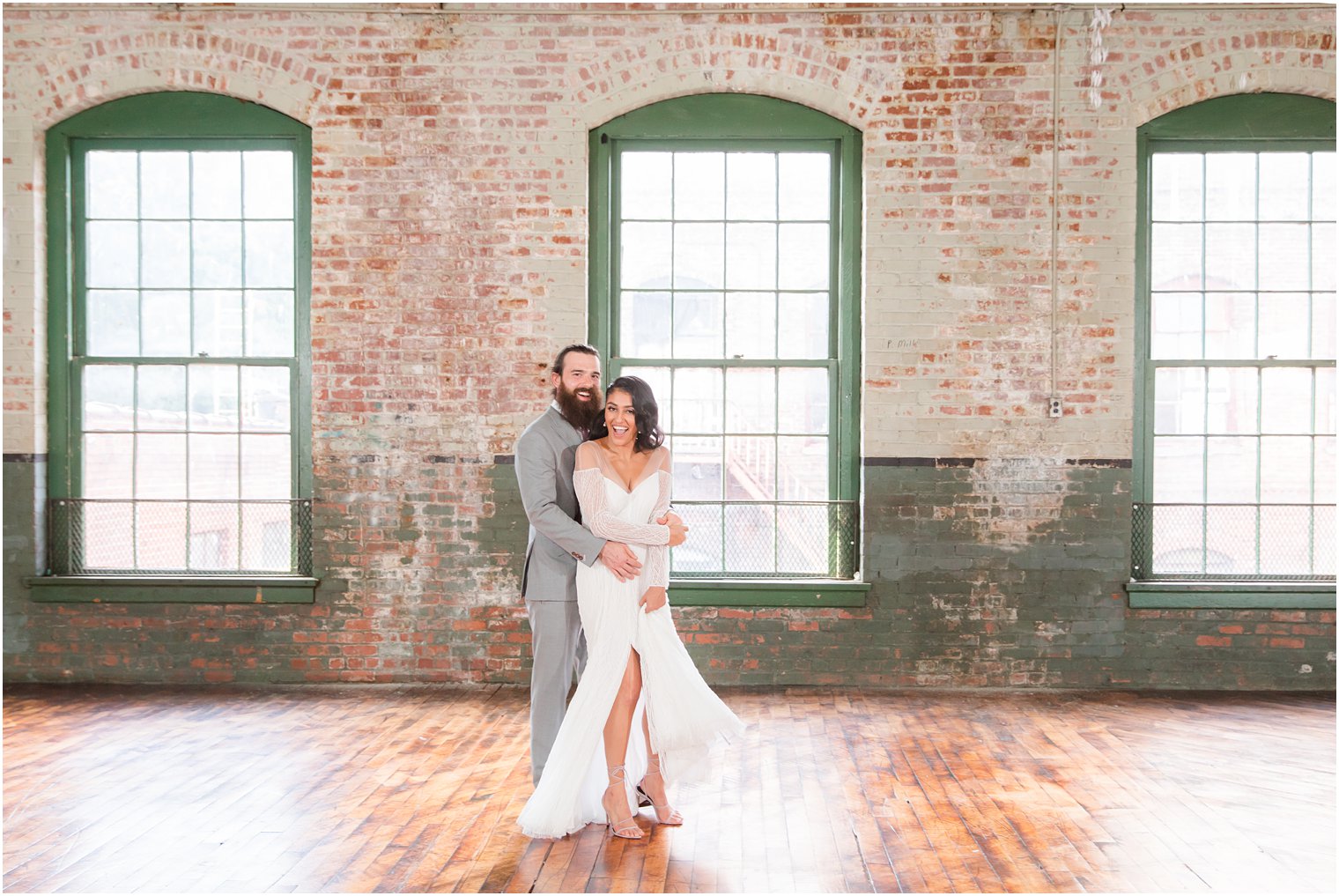 Candid photo of bride and groom dancing