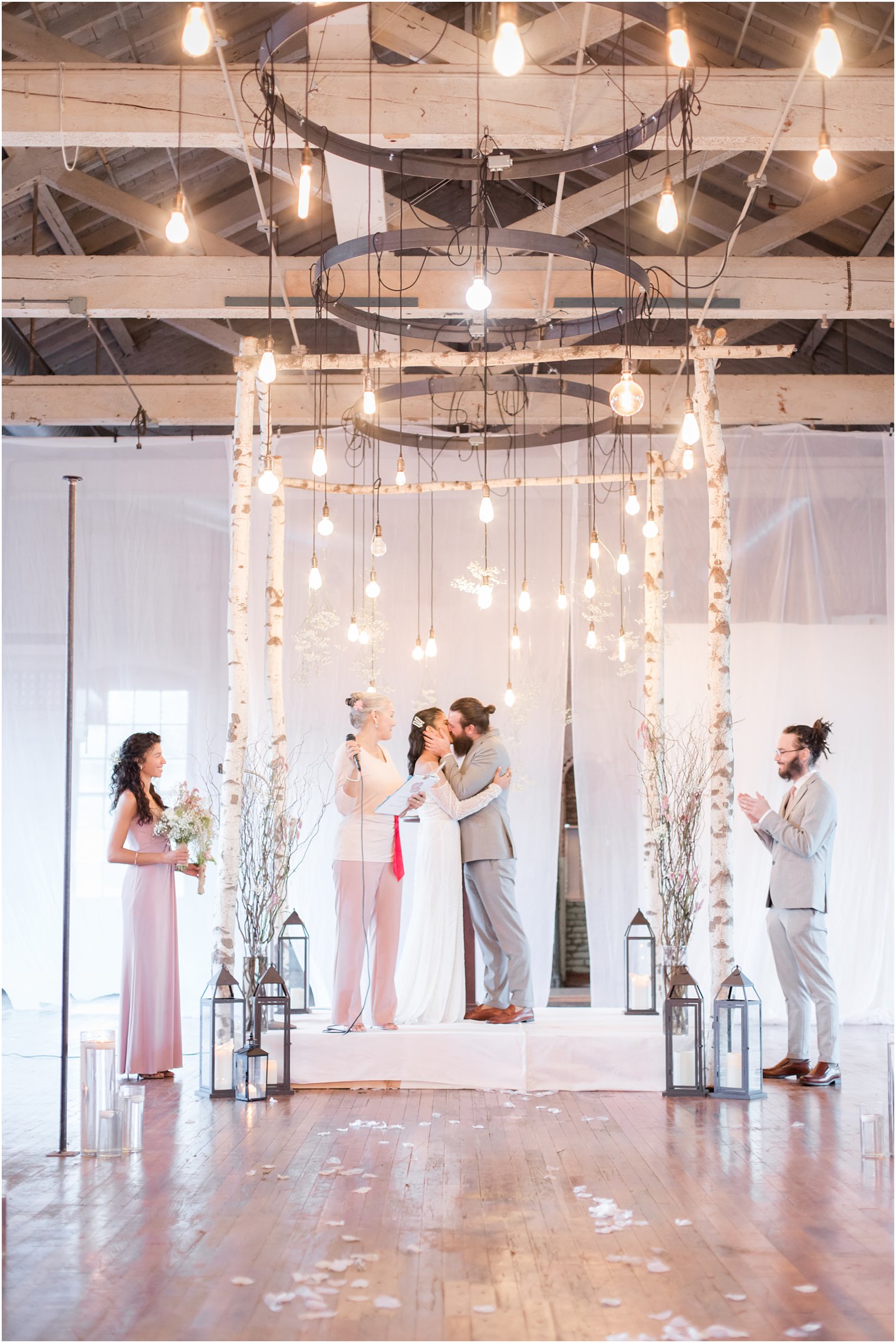 Bride and groom kissing during wedding ceremony at Art Factory Studios in Paterson NJ