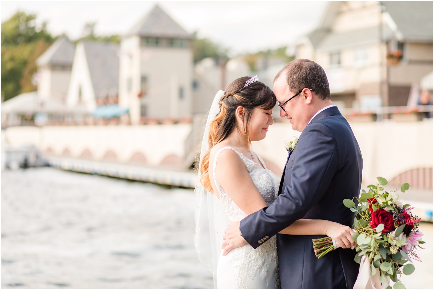 Idalia Photography photographs happy couple on Lake Mohawk wedding day