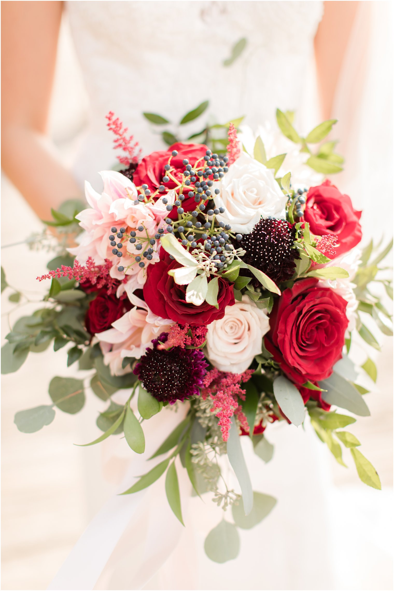 wedding bouquet with red roses by A Touch of Elegance Events