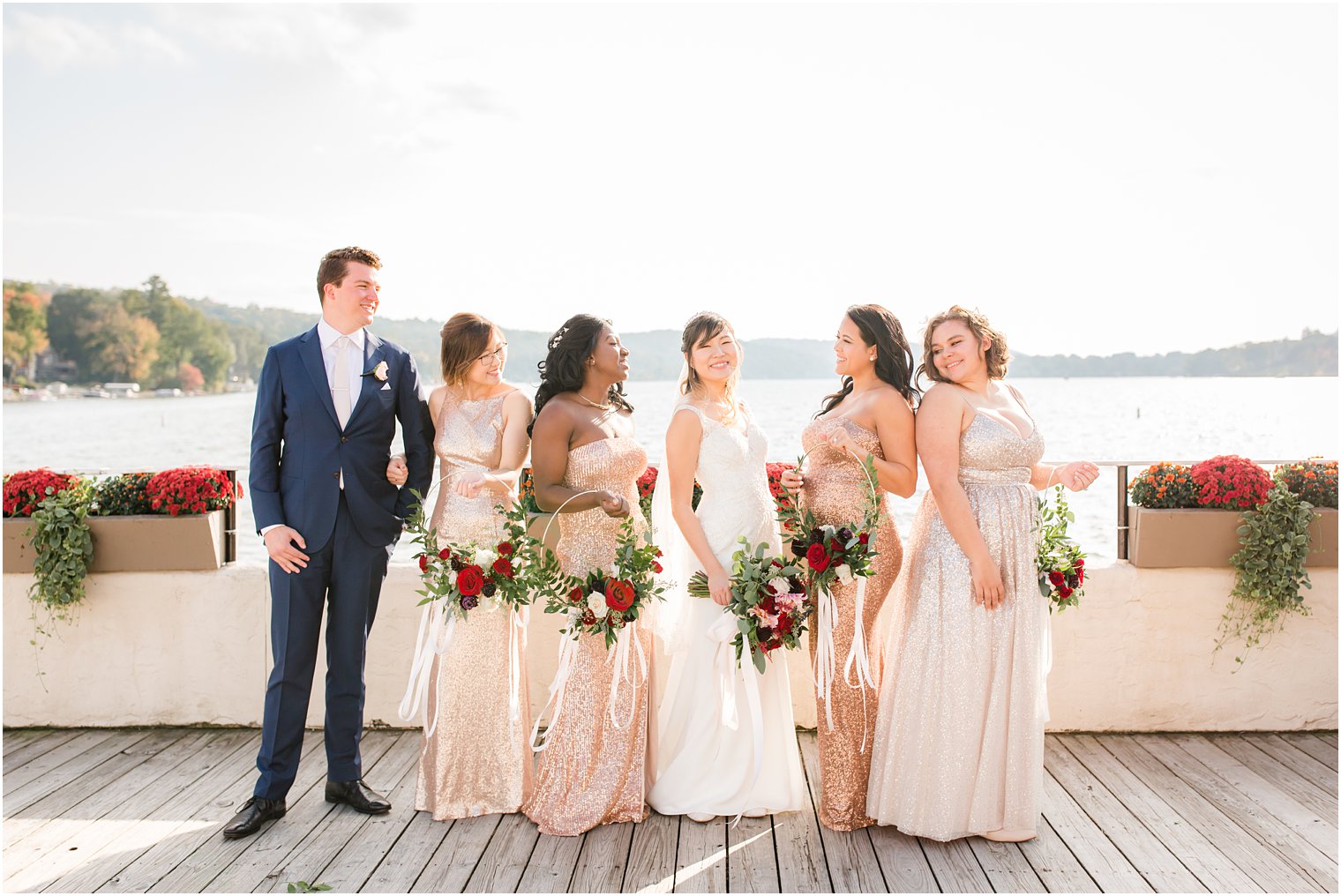 bridal party with floral hoops and bride pose on wedding day at Lake Mohawk