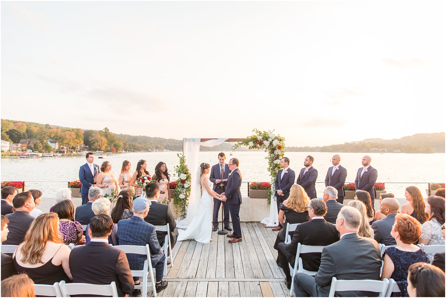 sunset waterfront wedding ceremony at Lake Mohawk