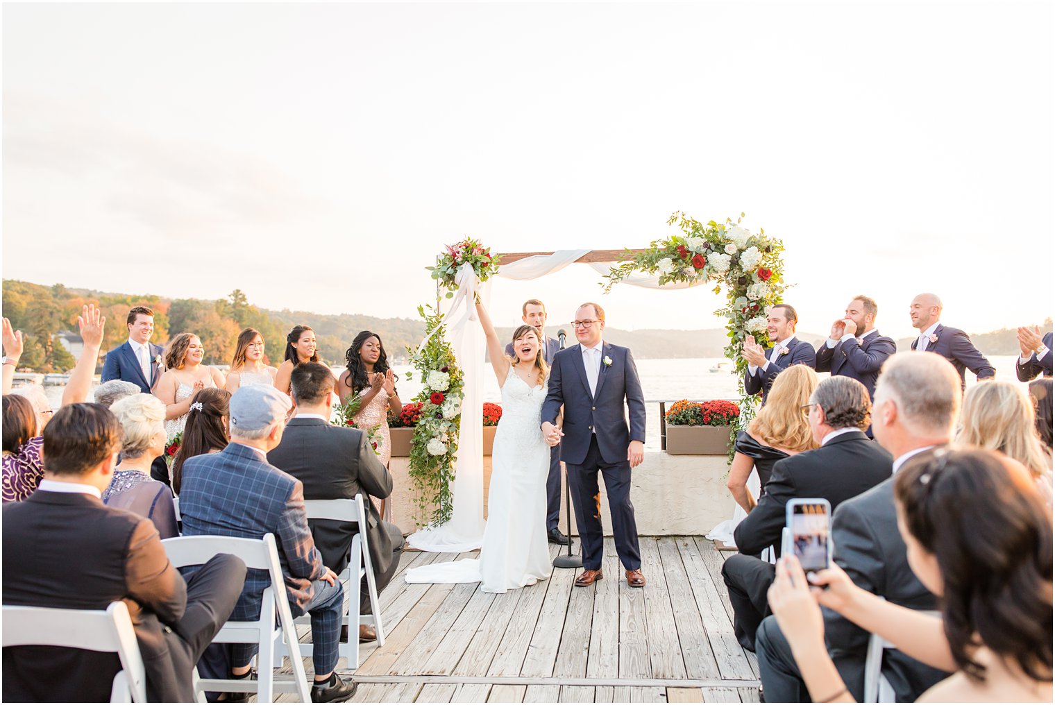 newlyweds at Lake Mohawk wedding ceremony by Idalia Photography