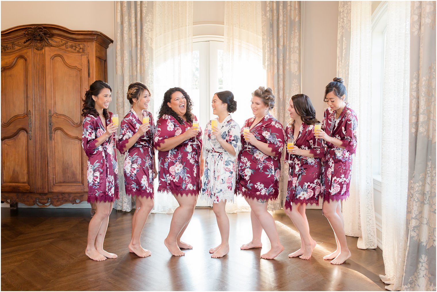 Idalia Photography photographs bridal party laughing before Park Chateau Estate wedding