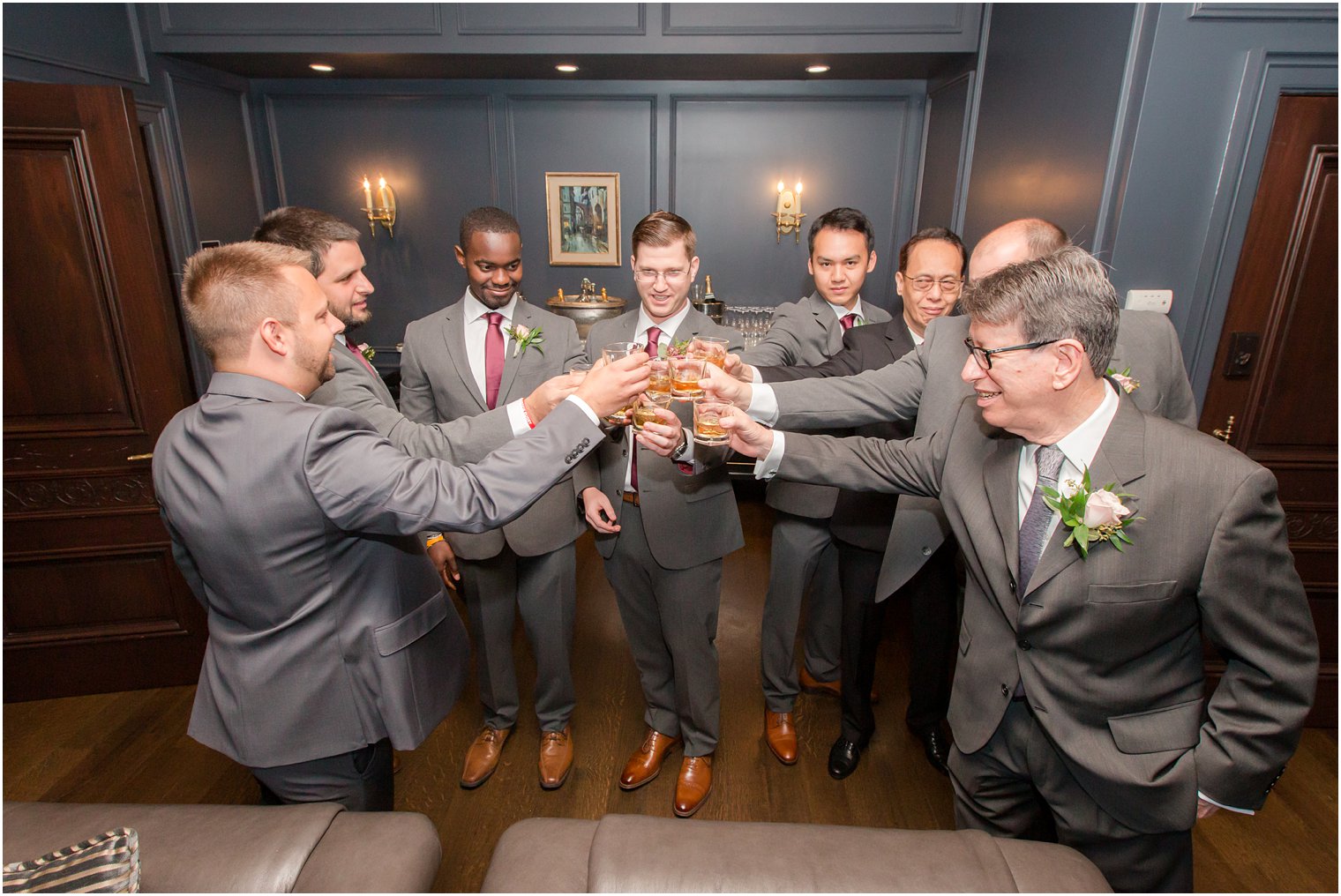 groomsmen cheer before Park Chateau Estate wedding day with Idalia Photography