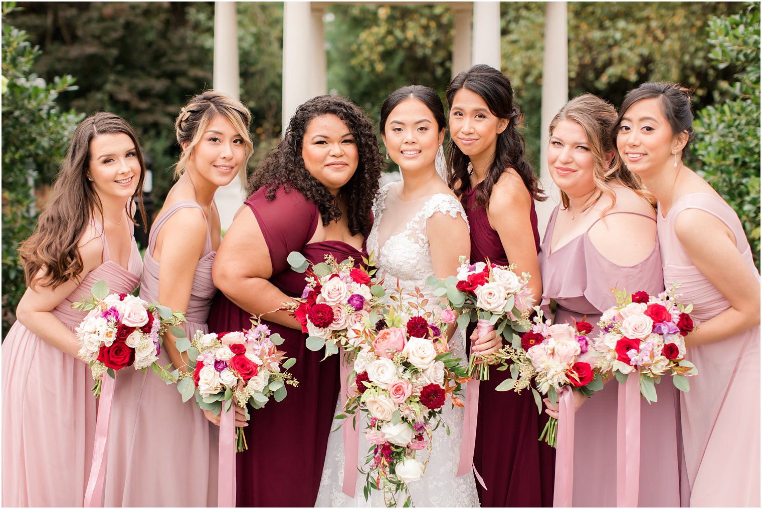 bride and bridesmaids with bouquets by Pink Dahlia Vintage for wedding day in East Brunswick NJ