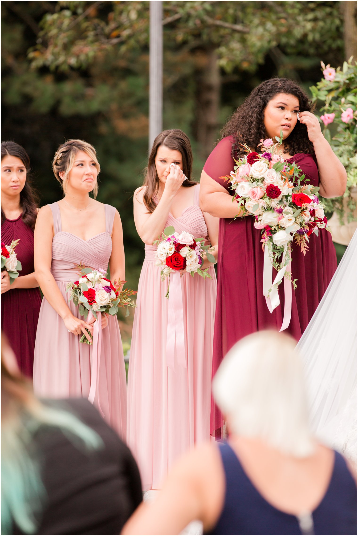 bridesmaids cry during wedding ceremony photographed by Idalia Photography