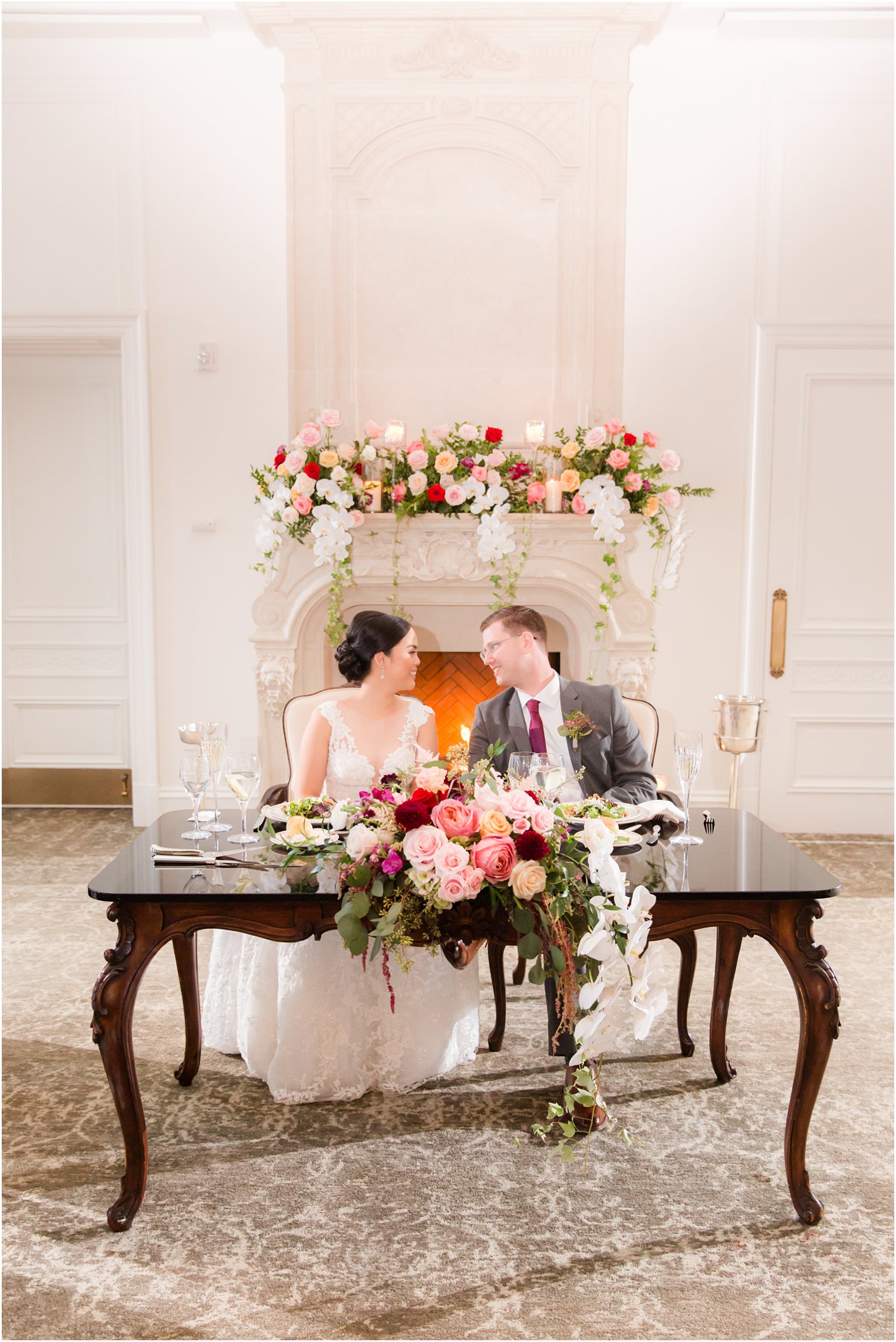 Couple at sweetheart table at fall wedding reception at Park Chateau Estate