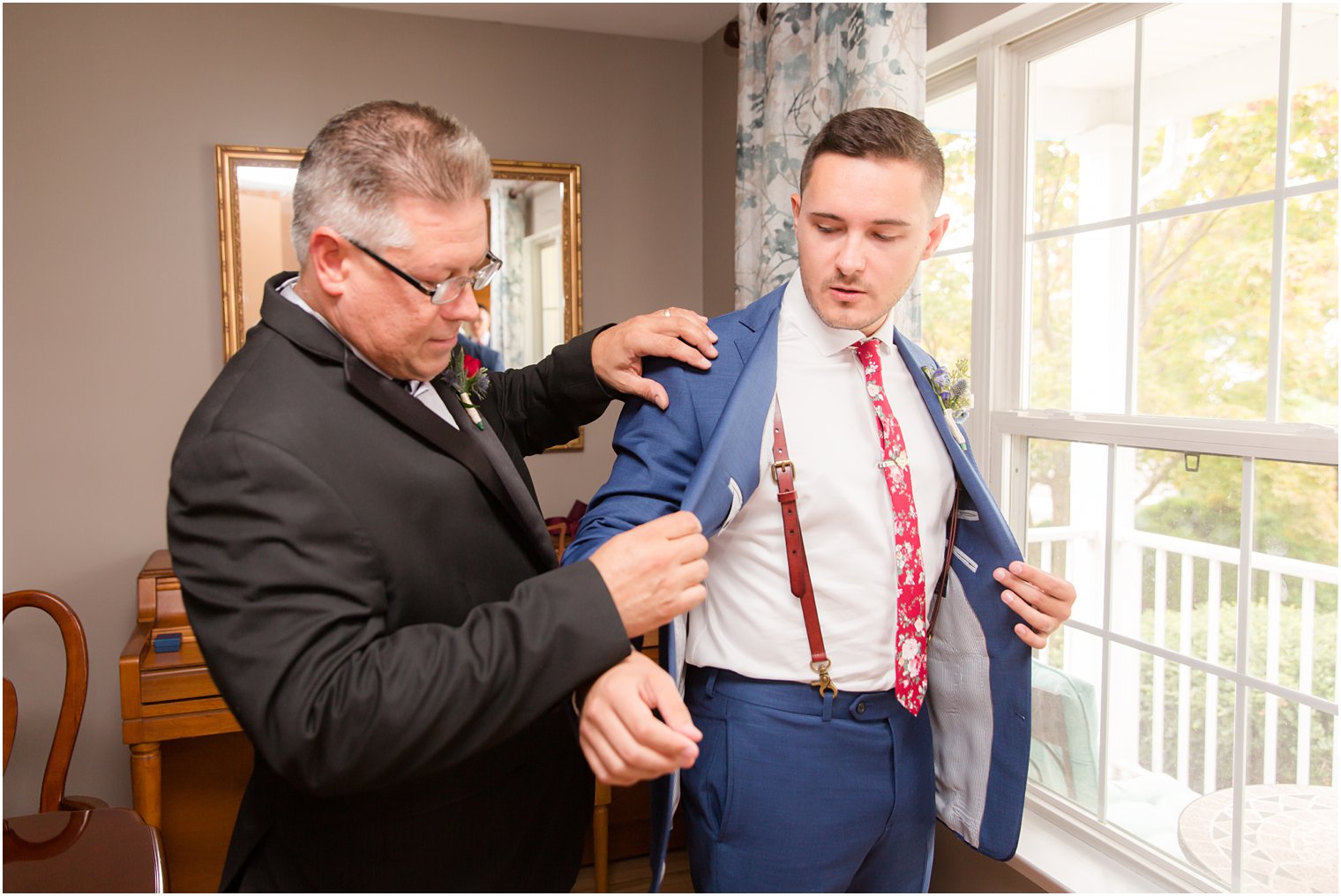 Groom getting ready with his father