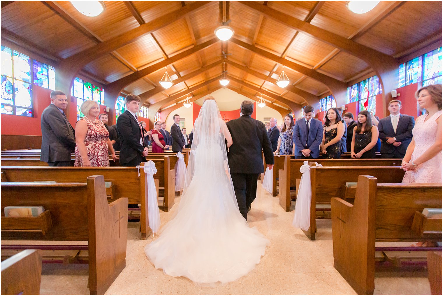 Bride walking down the aisle at St. Veronica's Church in Howell, NJ