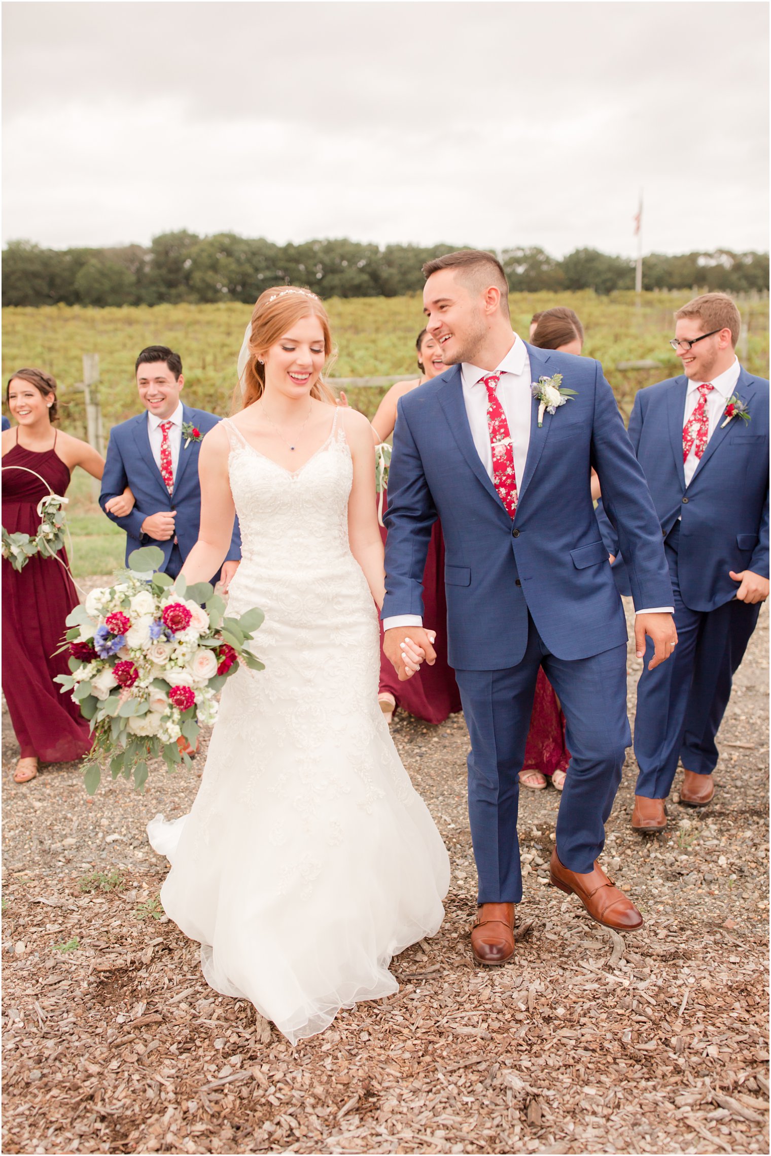 Candid photo of bride and groom walking at Laurita Winery