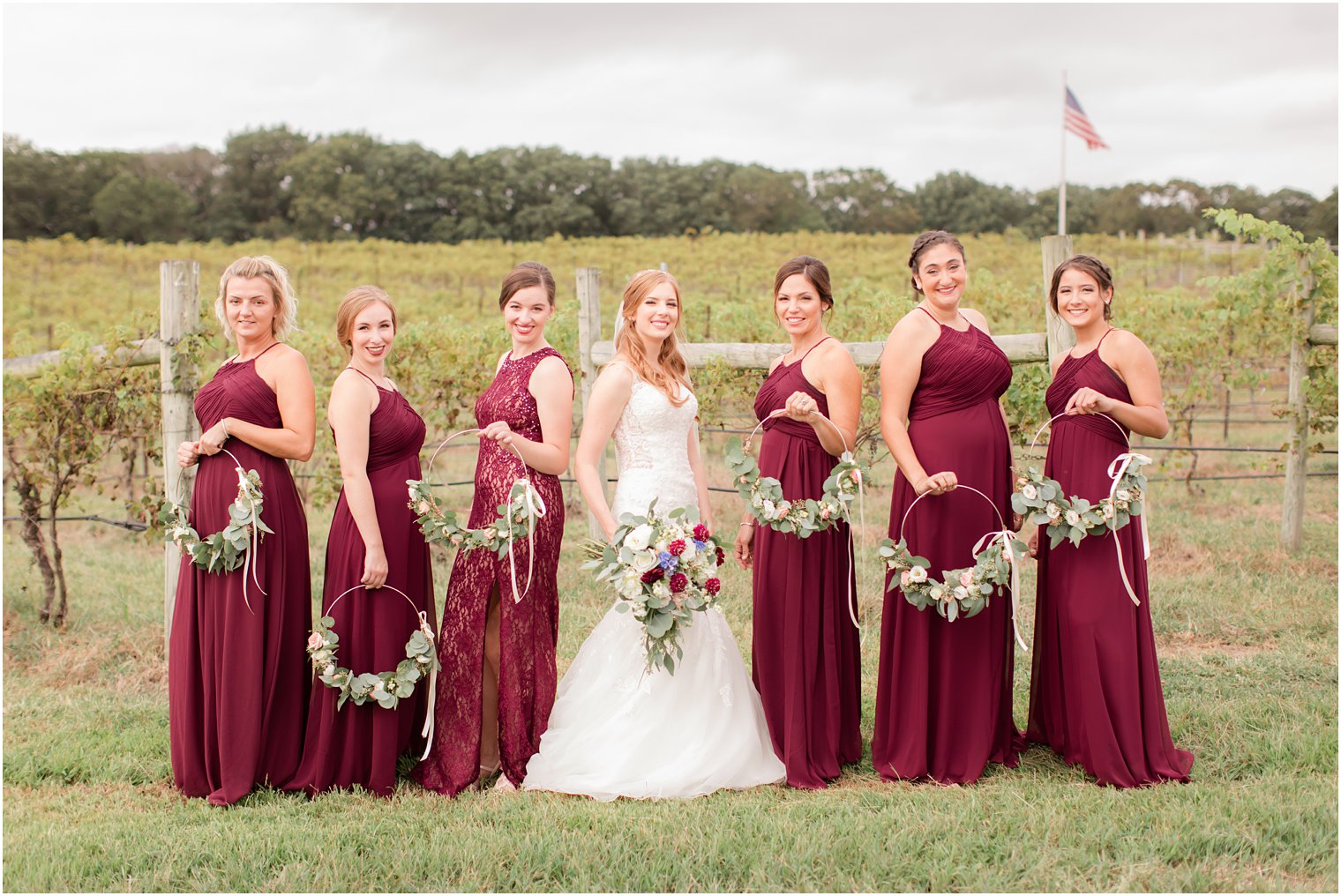 Bridesmaids wearing maroon dresses at Laurita Winery