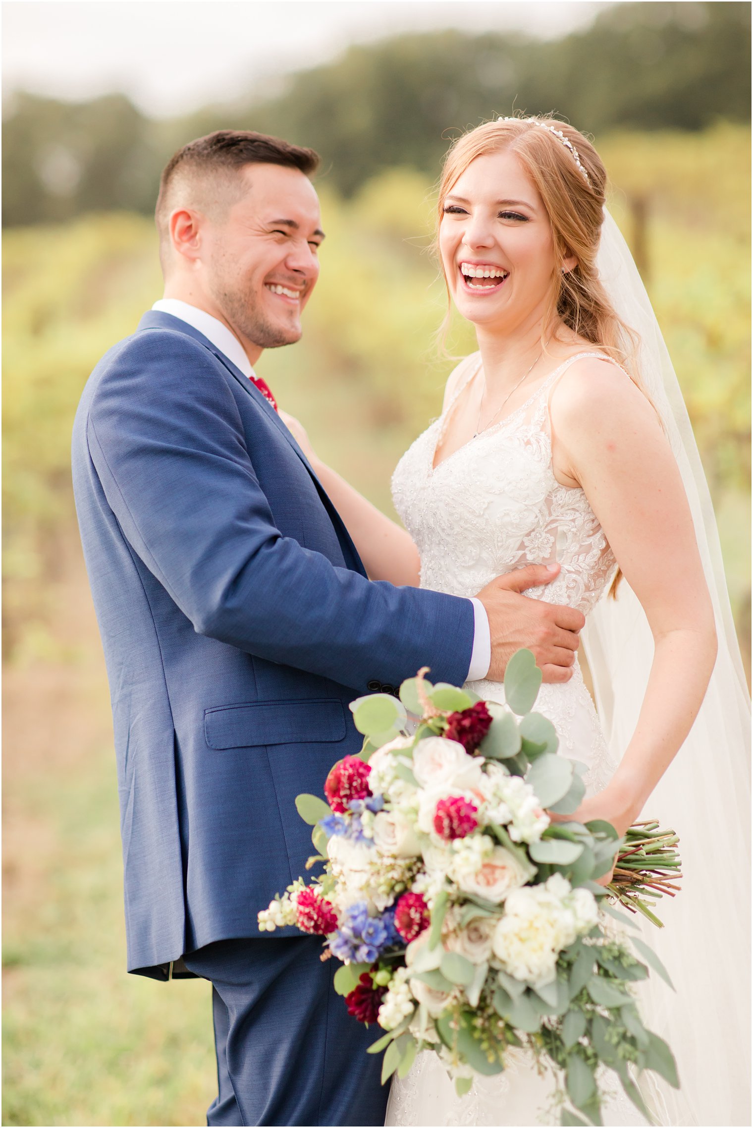 Bride and groom laughing on wedding day