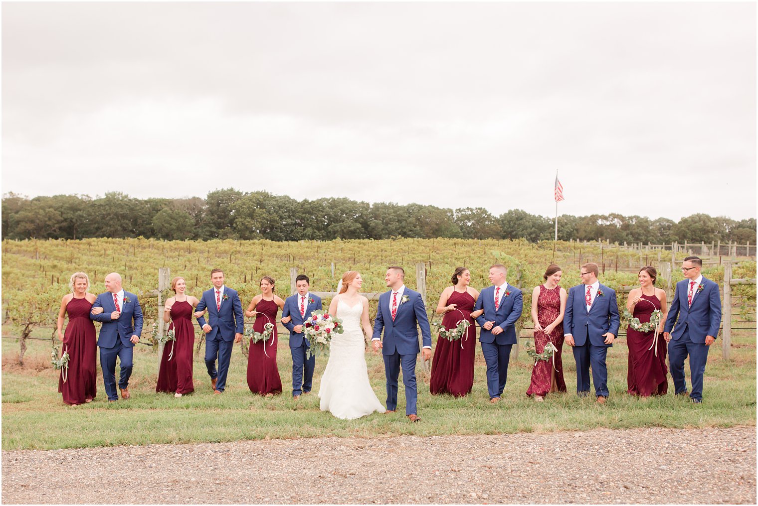 Bridal party walking on grounds of Laurita Winery
