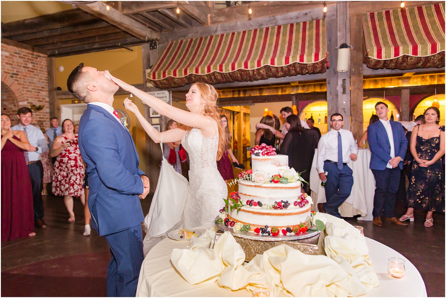Cake cutting during wedding at Laurita Winery