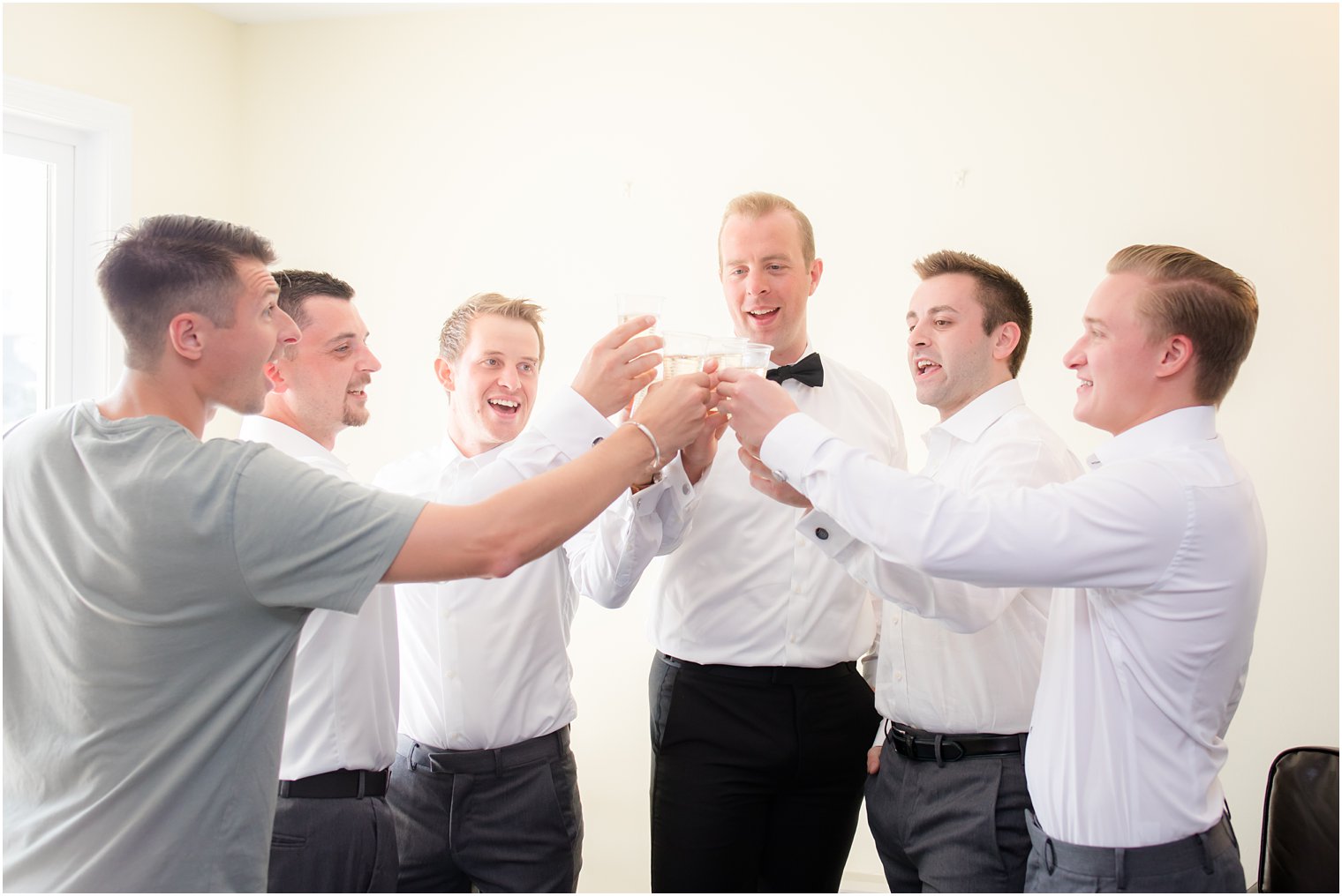 Groomsmen toasting on wedding morning