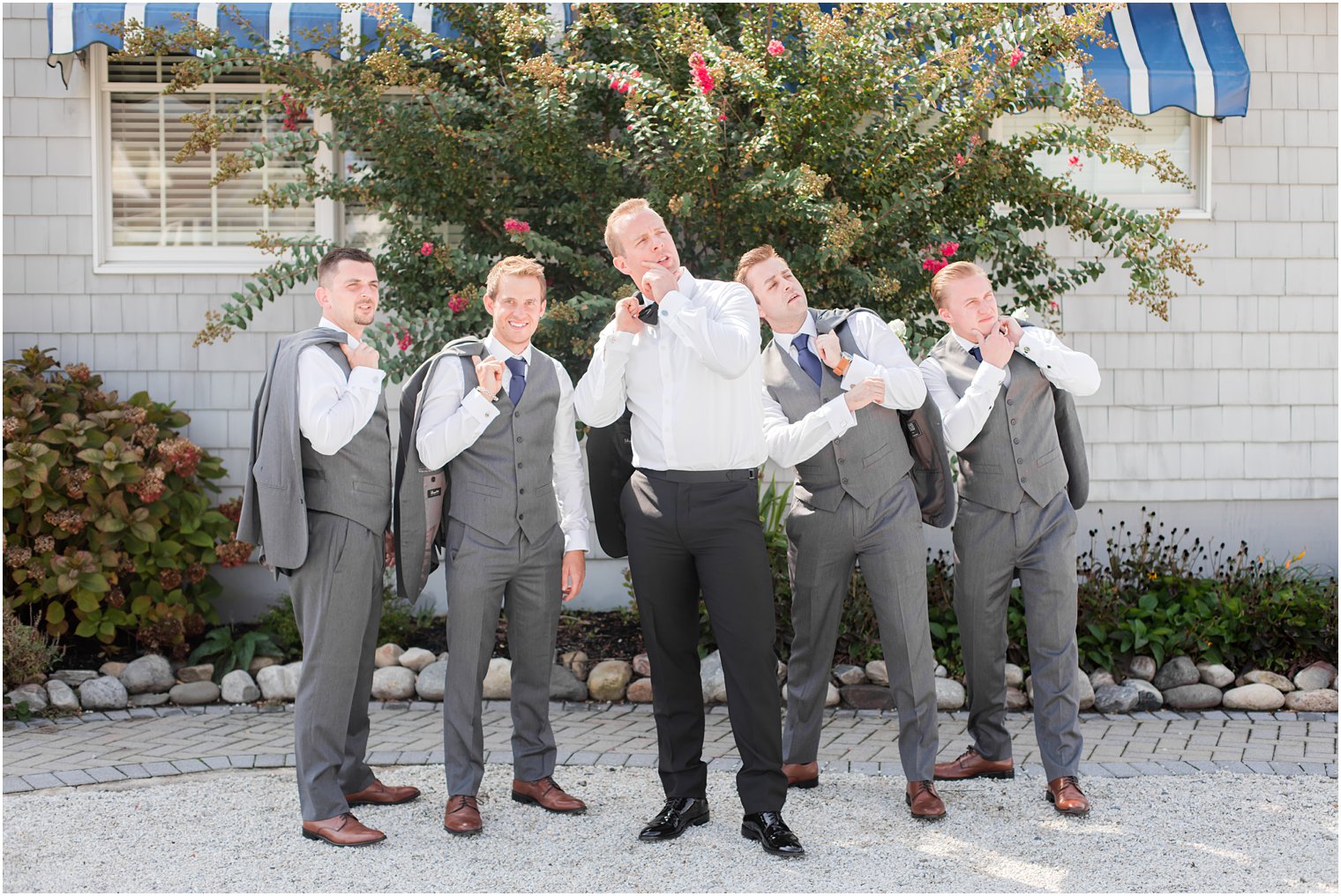 Groom posing with groomsmen