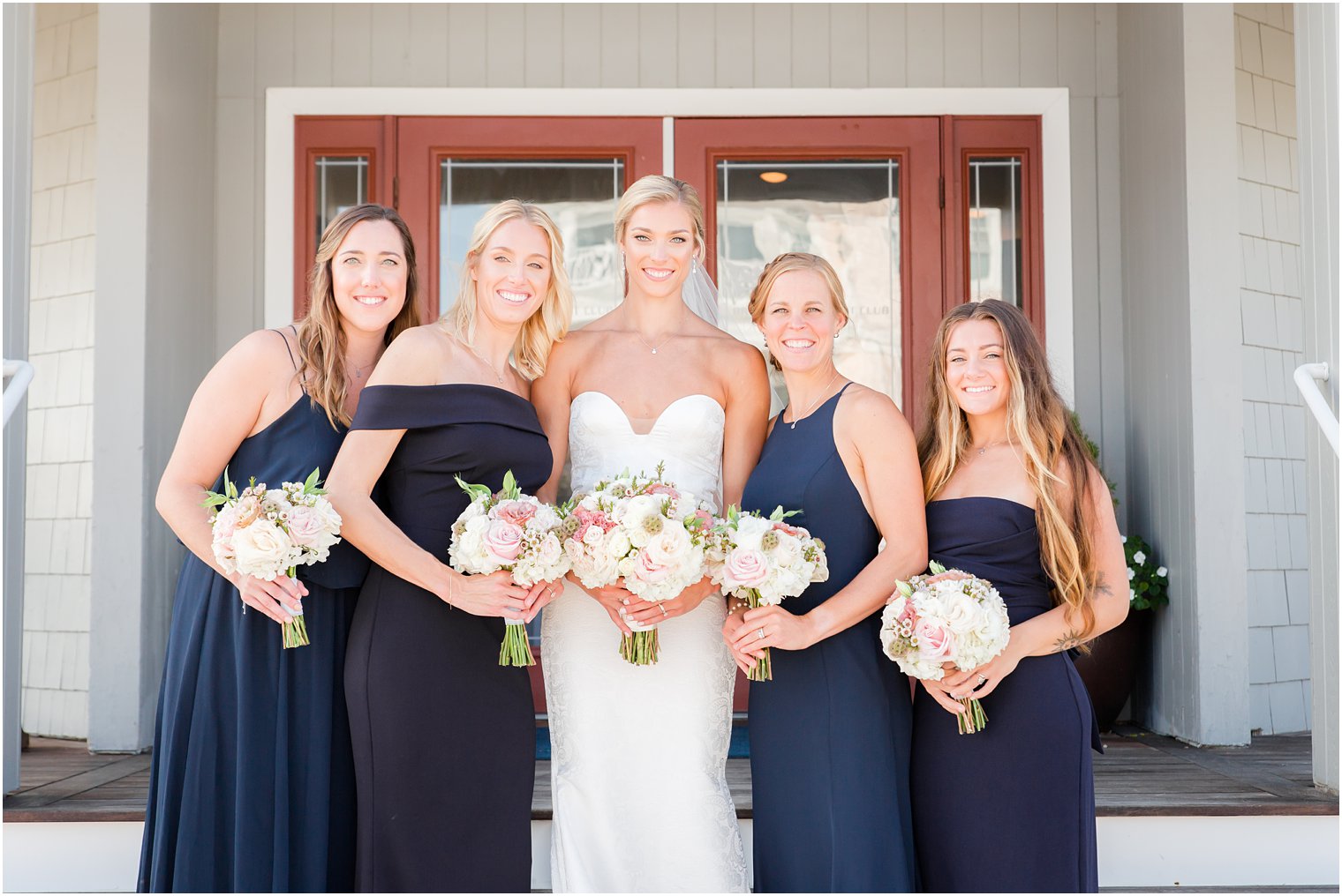 Bridesmaids in front of Brant Beach Yacht Club