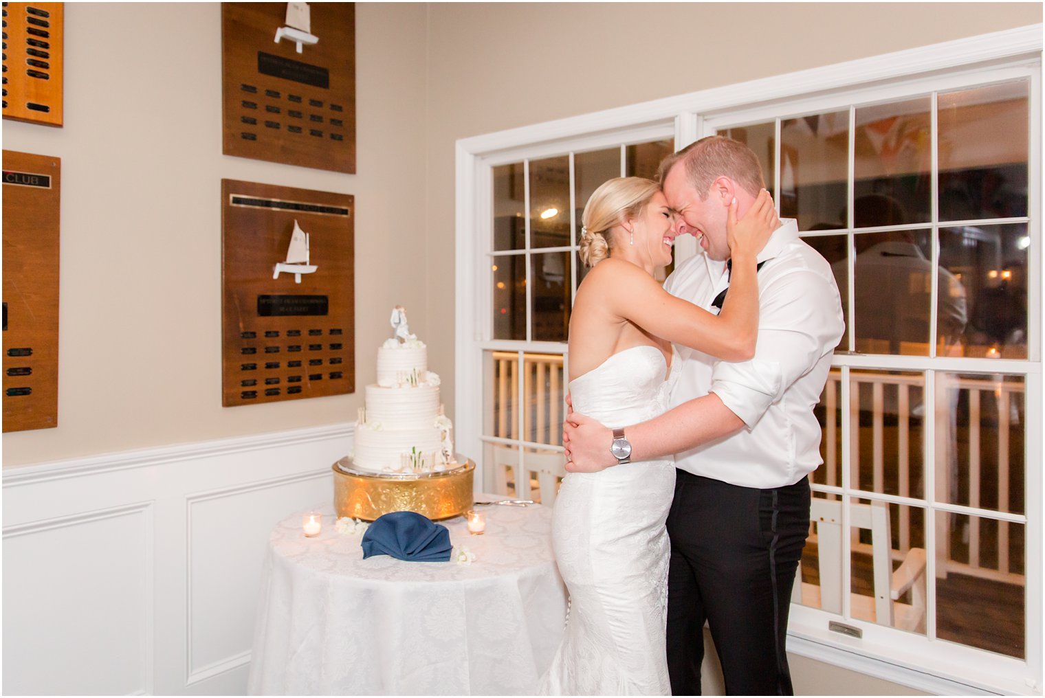 wedding cake cutting at Brant Beach Yacht Club by LBI Wedding Photographers Idalia Photography