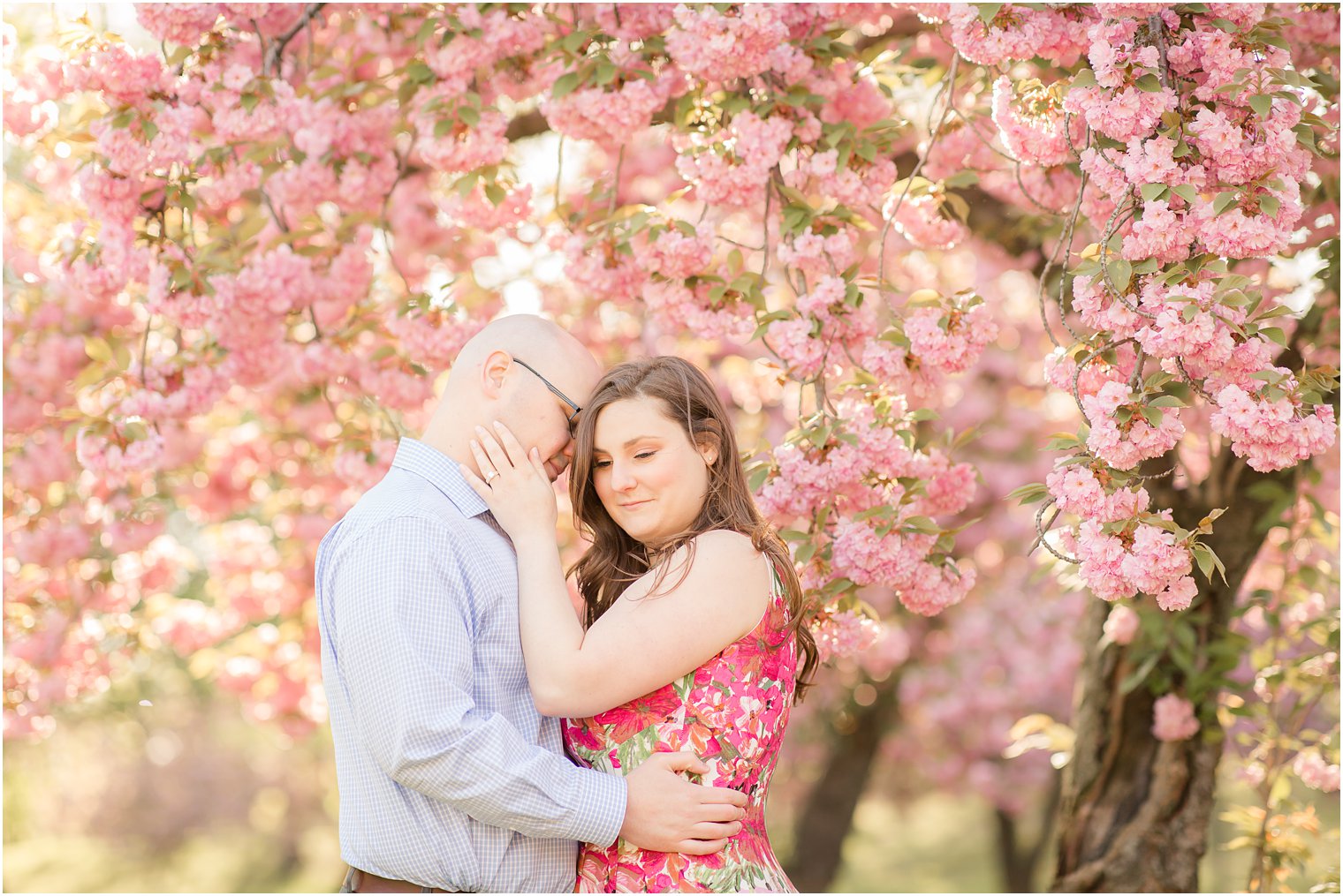 Bride wearing floral dress for engagement photos