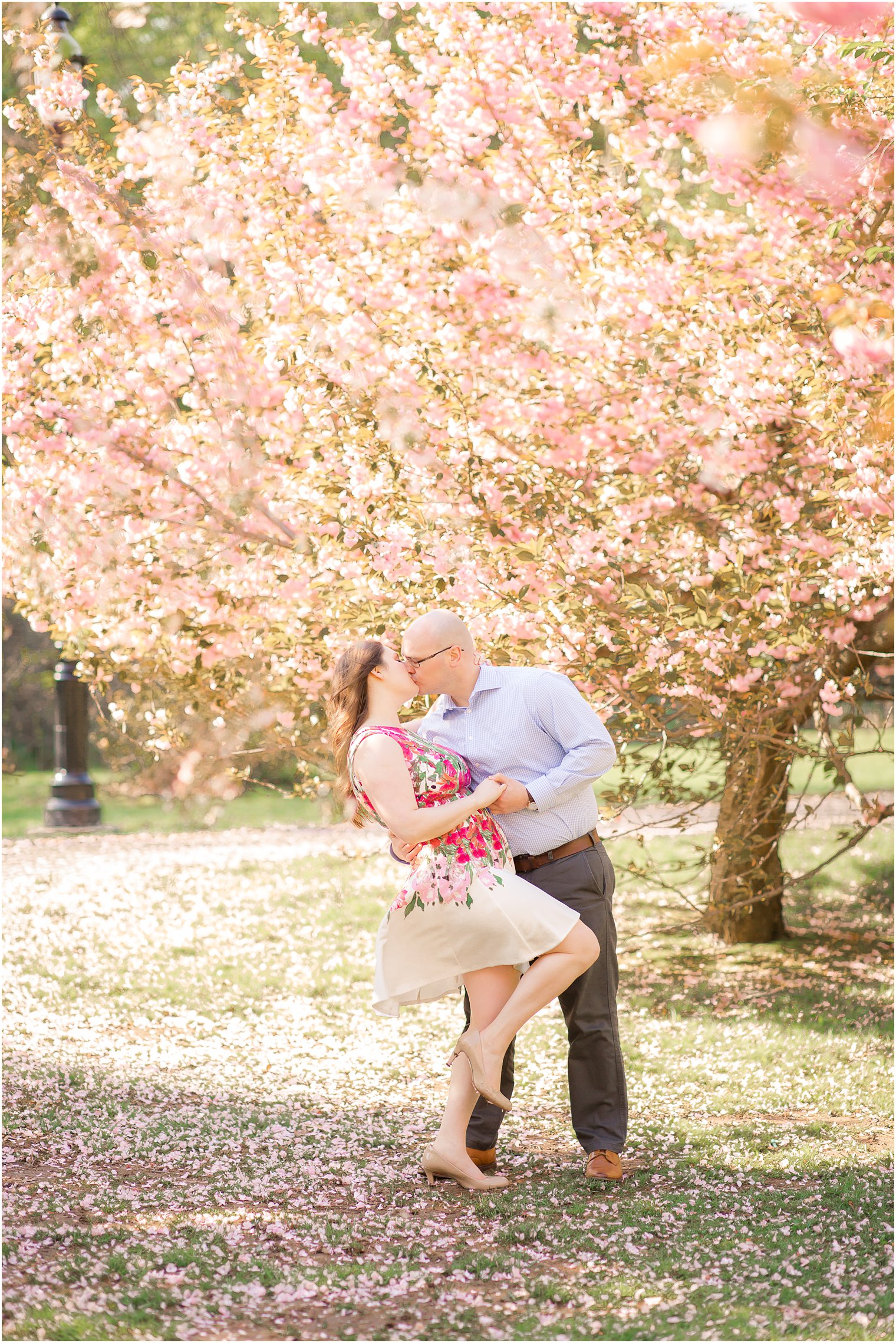 Groom kissing bride during engagement photos