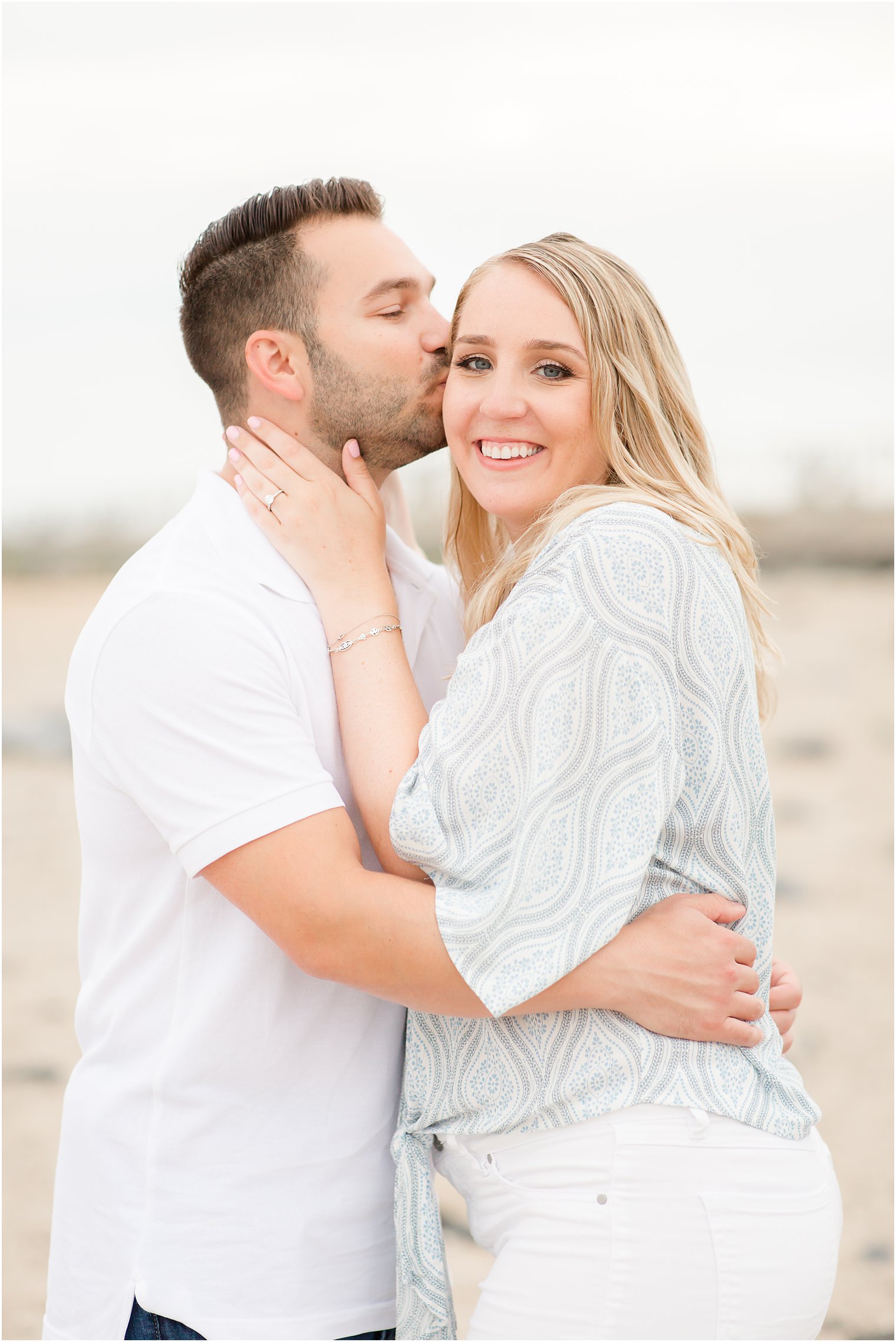 couple poses on LBI with Idalia Photography