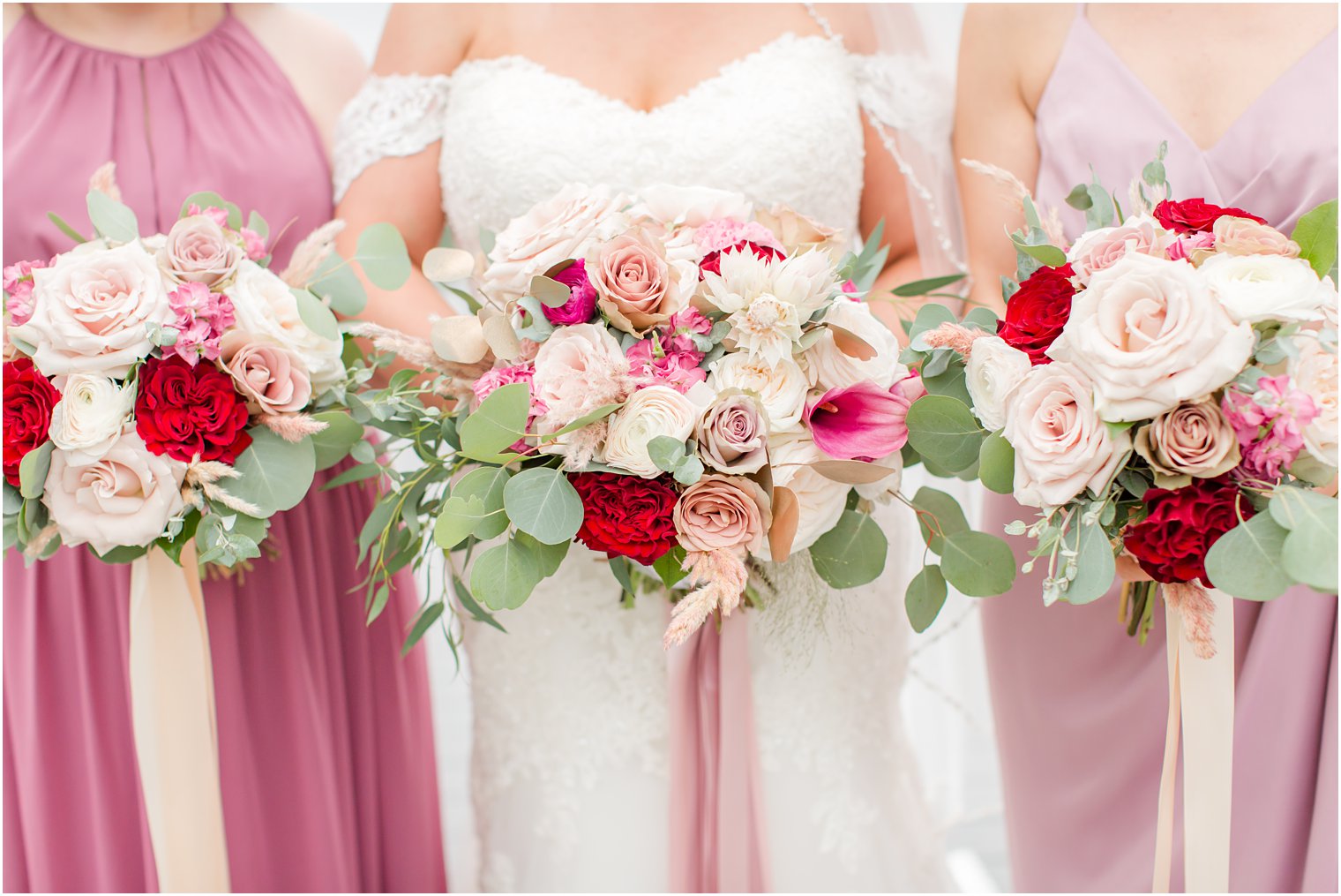 Pink, ivory, and red wedding bouquets by Narcissus Florals
