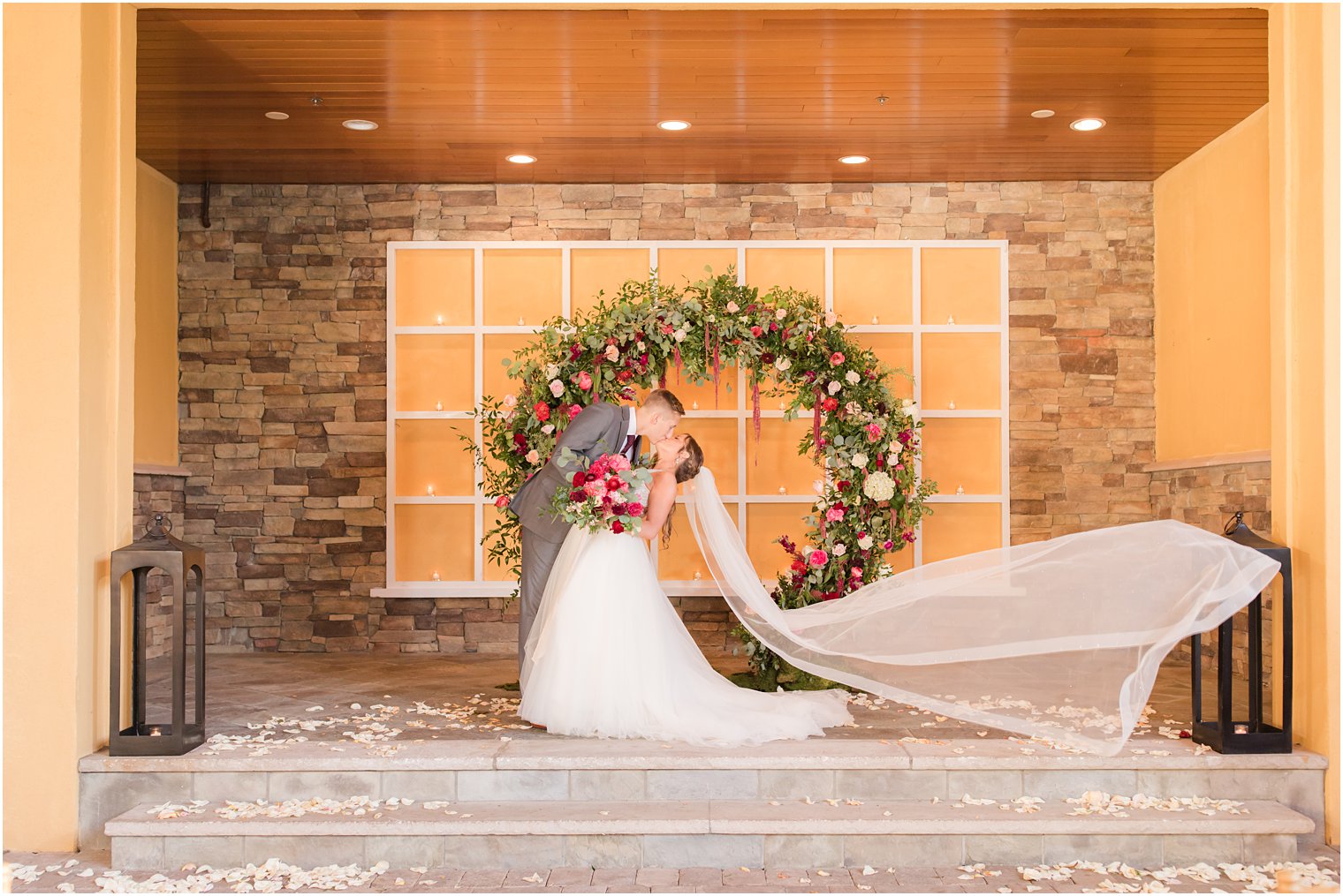 bride and groom portraits at Stone House at Stirling Ridge with floral arch by Pink Dahlia Vintage