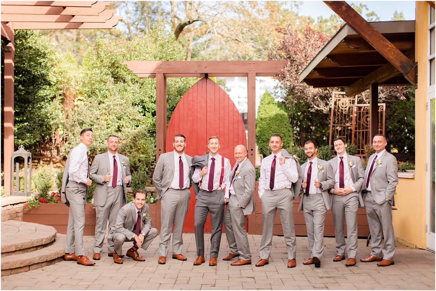 groomsmen in burgundy and grey photographed by Idalia Photography