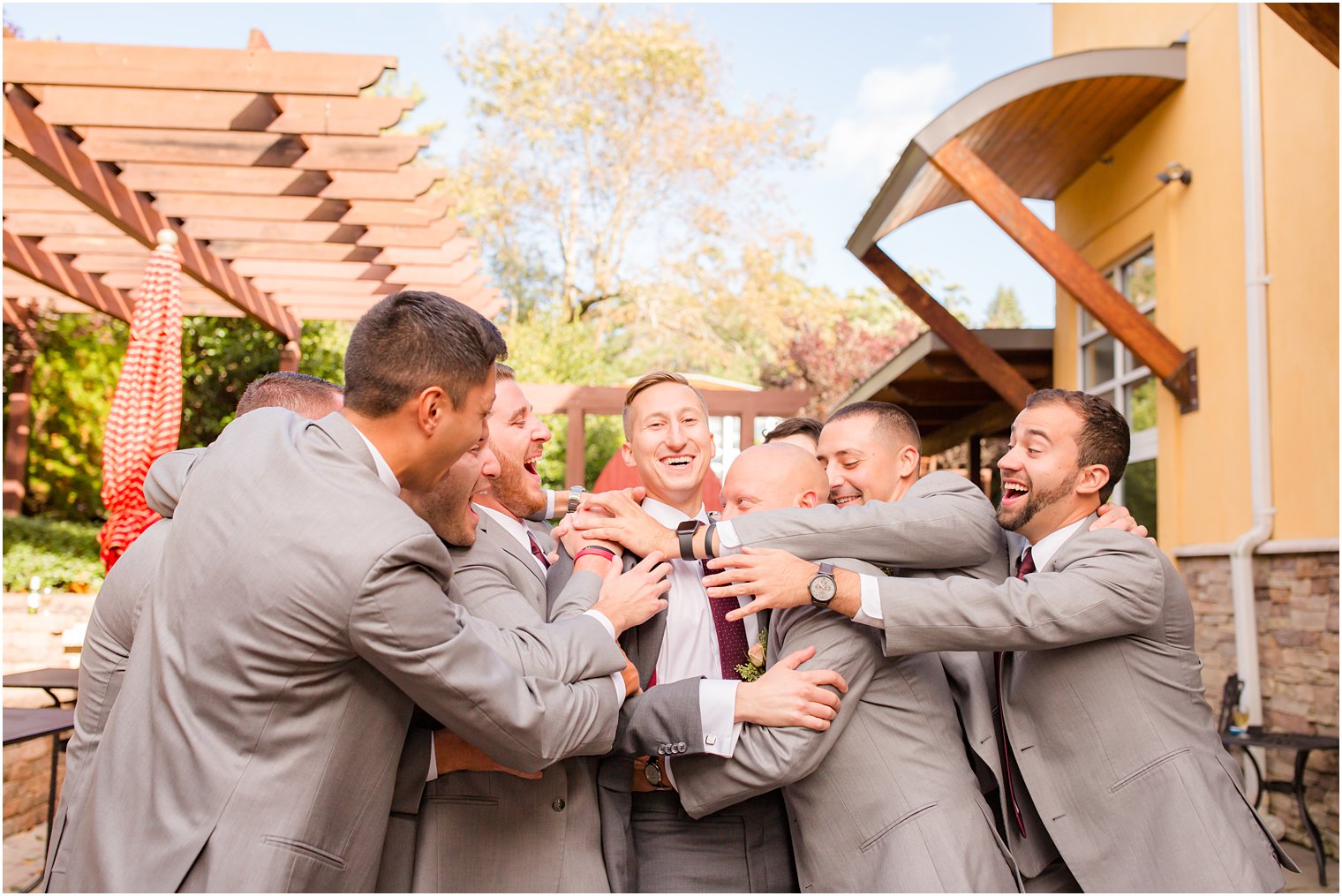 silly groomsmen photos by Idalia Photography