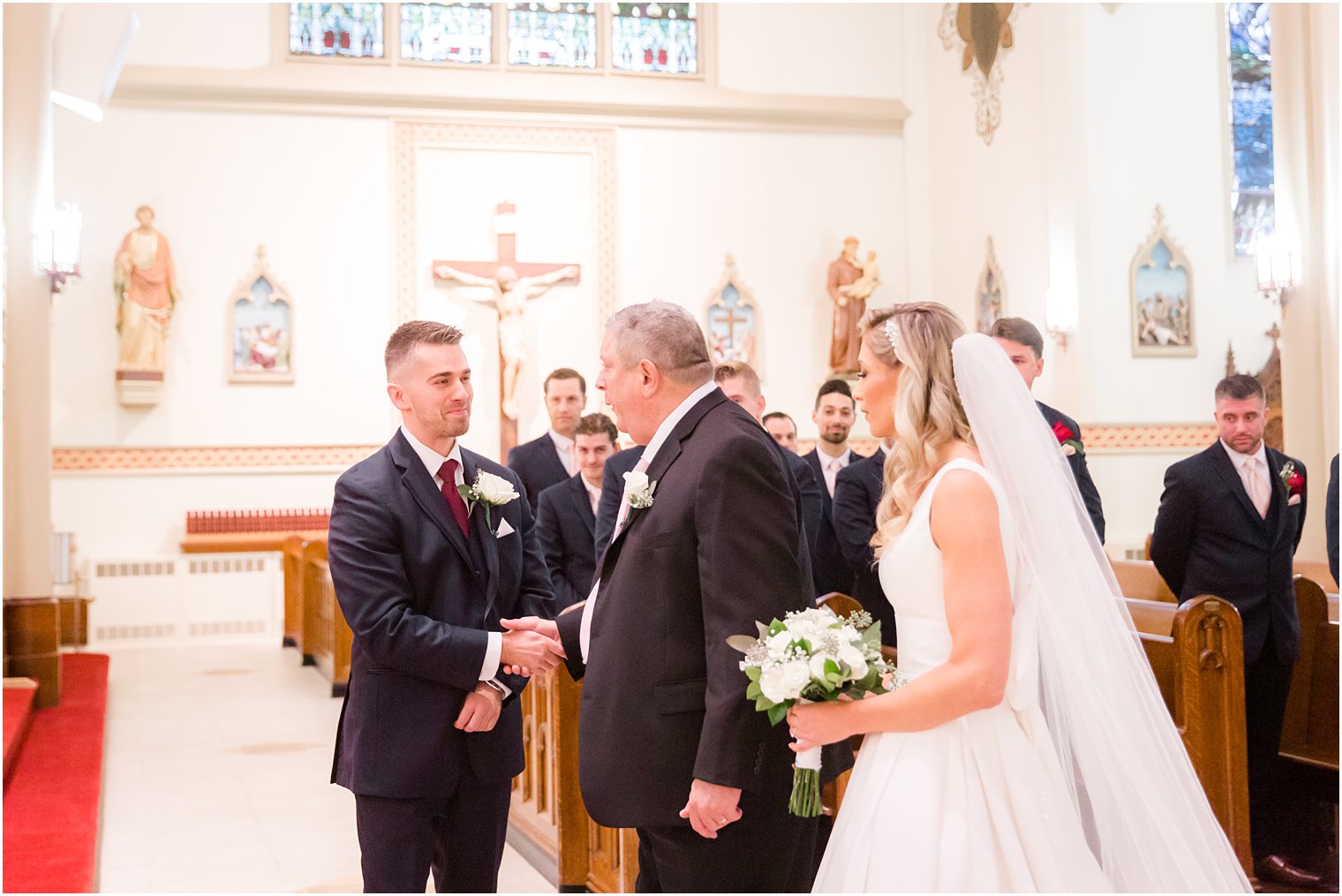 father gives daughter away in traditional church wedding 