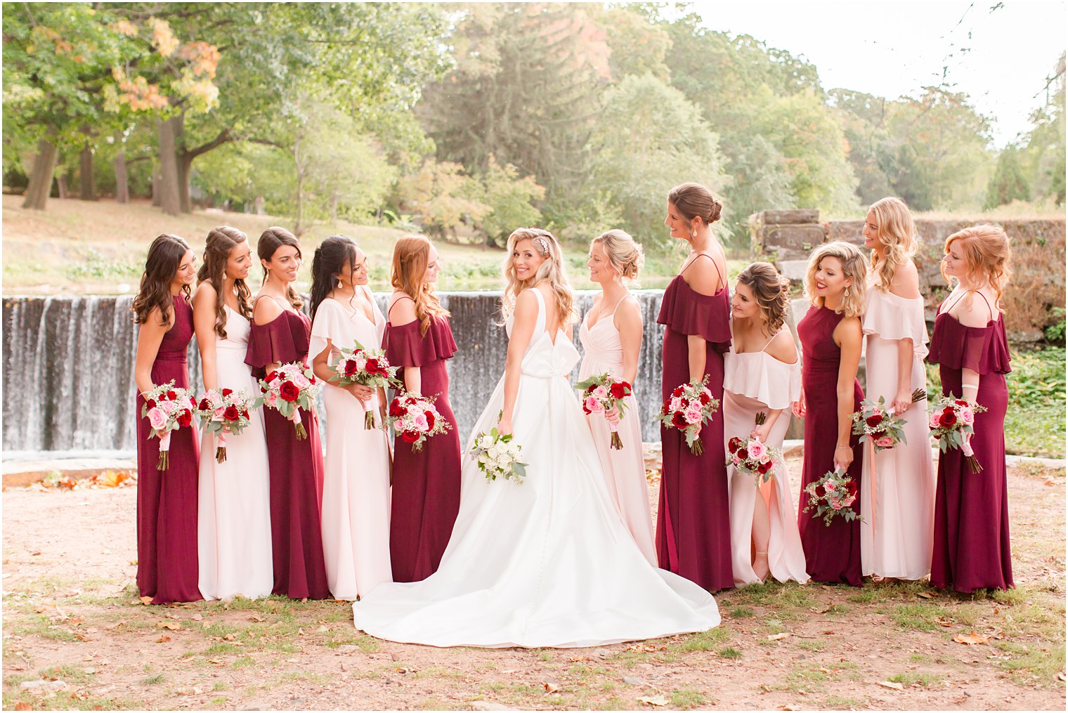 bridesmaids in burgundy and pink photographed by Idalia Photography