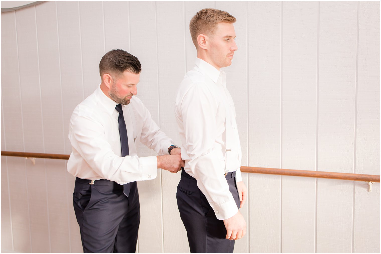 groom prepares for Windows on the Water at Frogbridge wedding with Idalia Photography