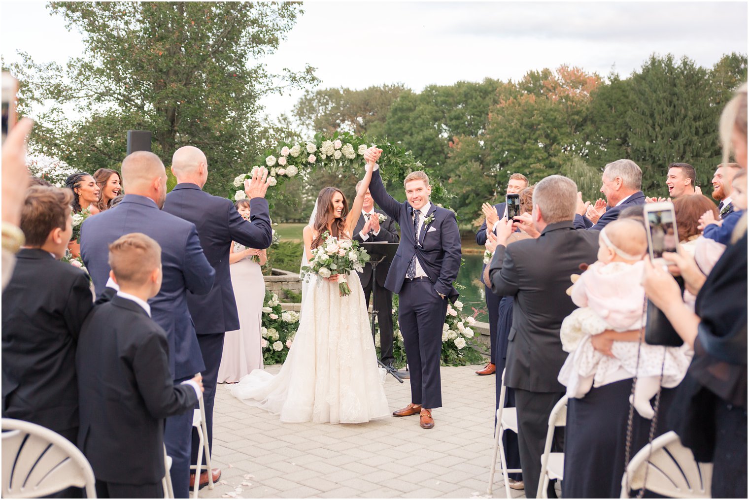 newlyweds leave Windows on the Water at Frogbridge wedding ceremony