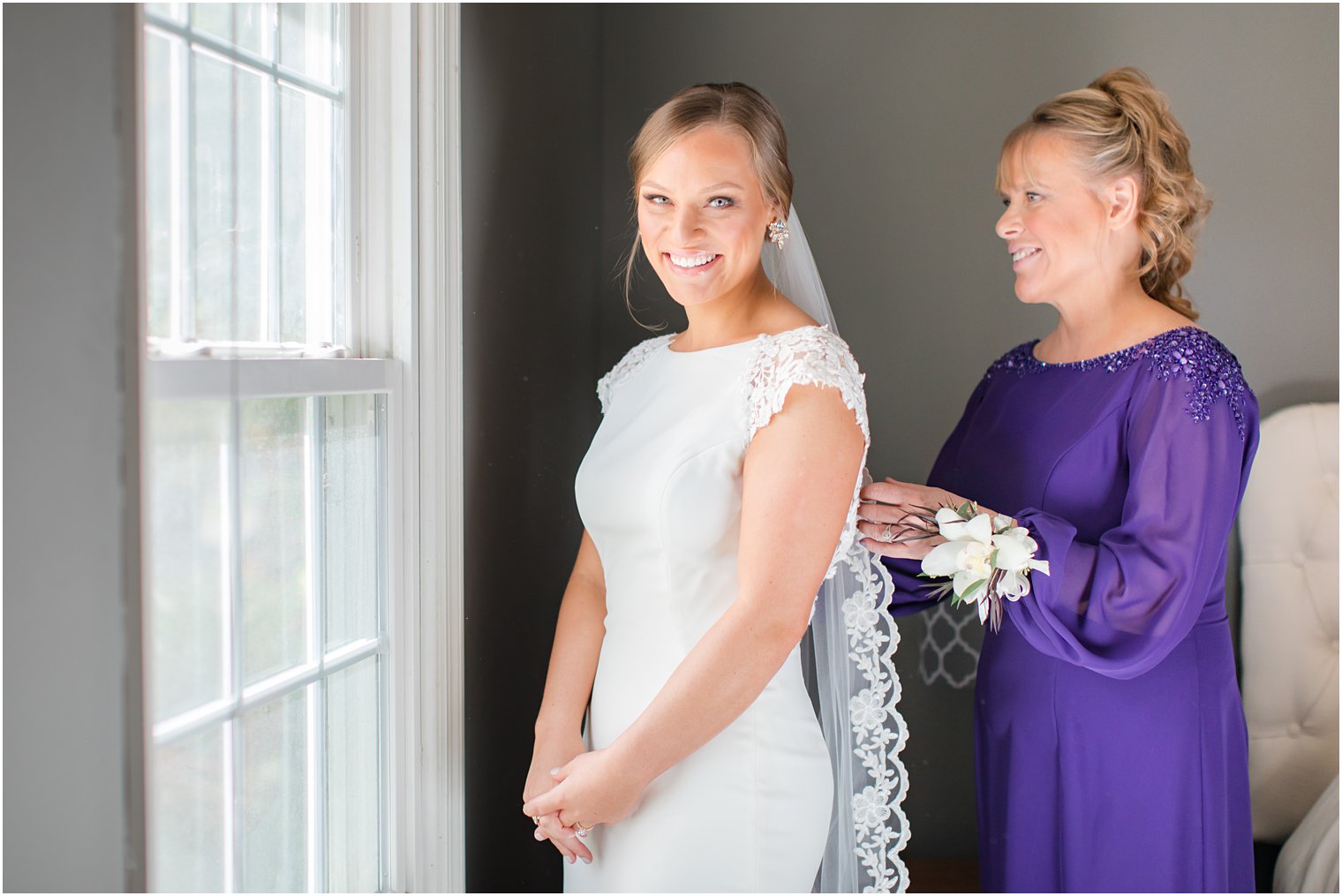 bride prepares for wedding day with mother photographed by Idalia Photography