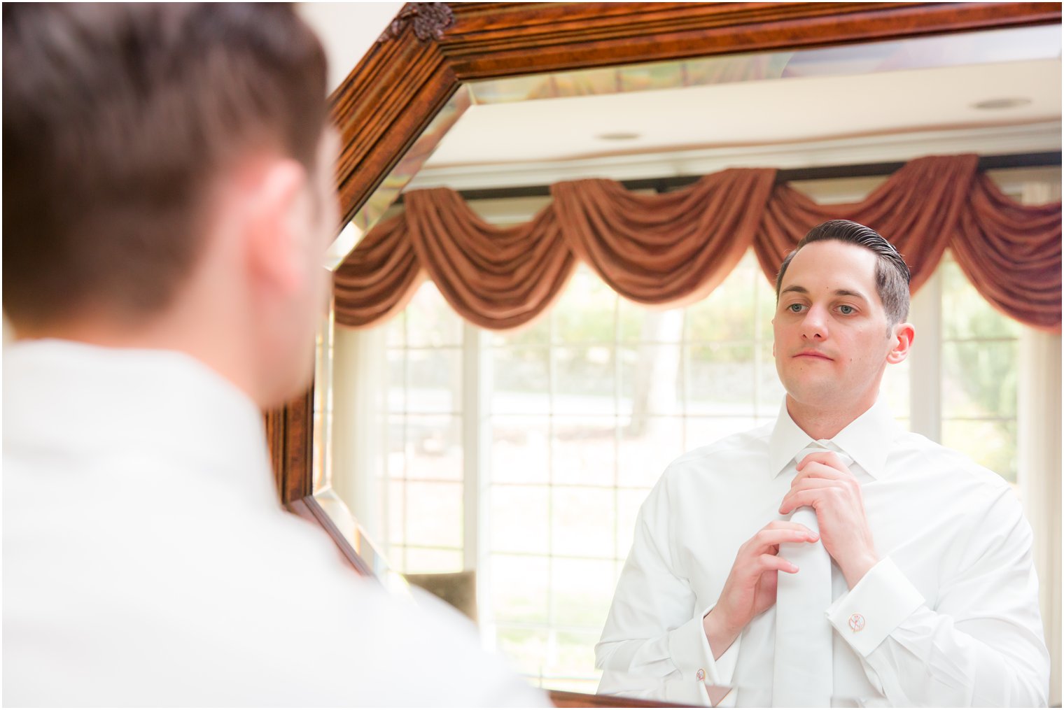 groom prepares for wedding day with Idalia Photography