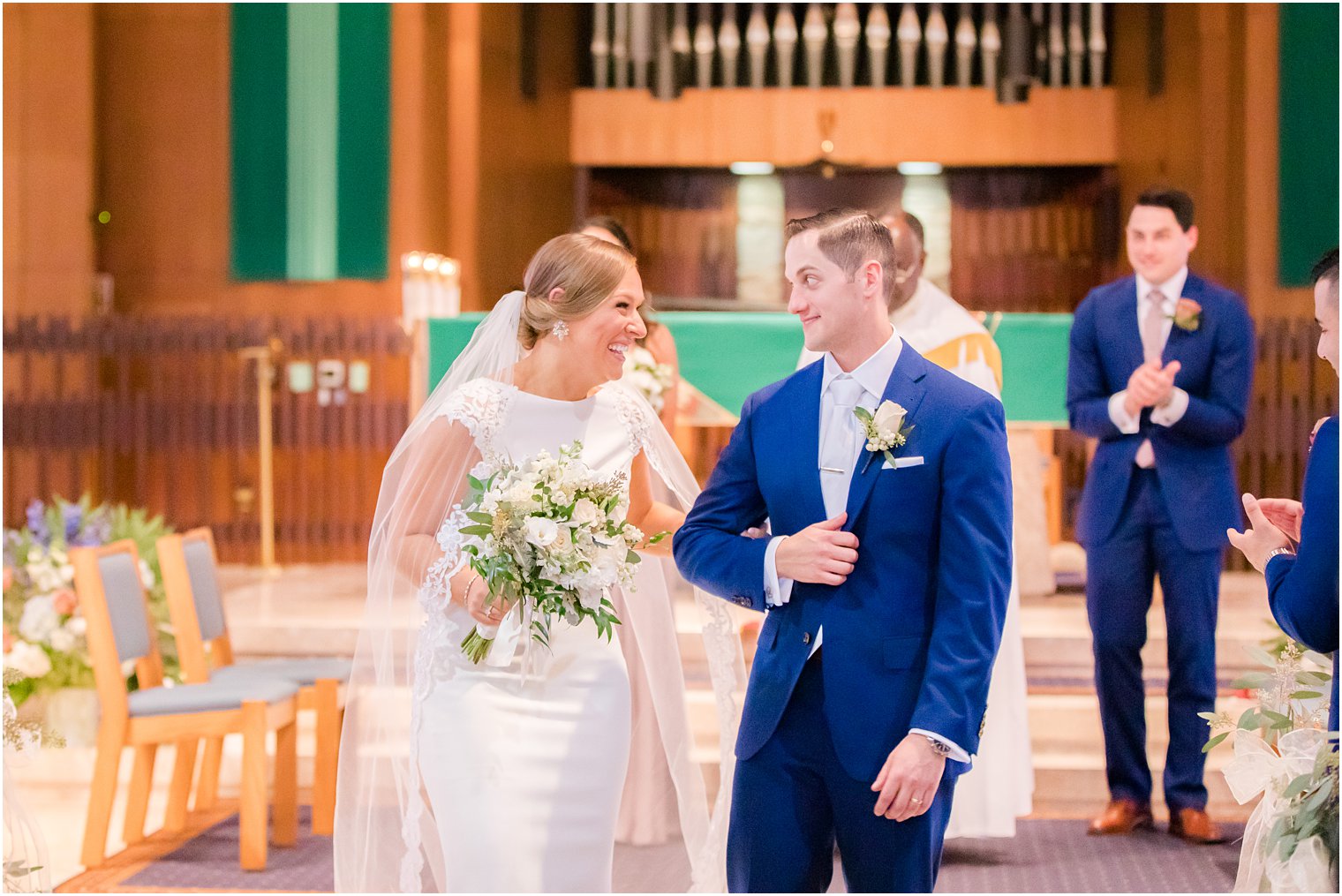 newlyweds walk up aisle in NY church