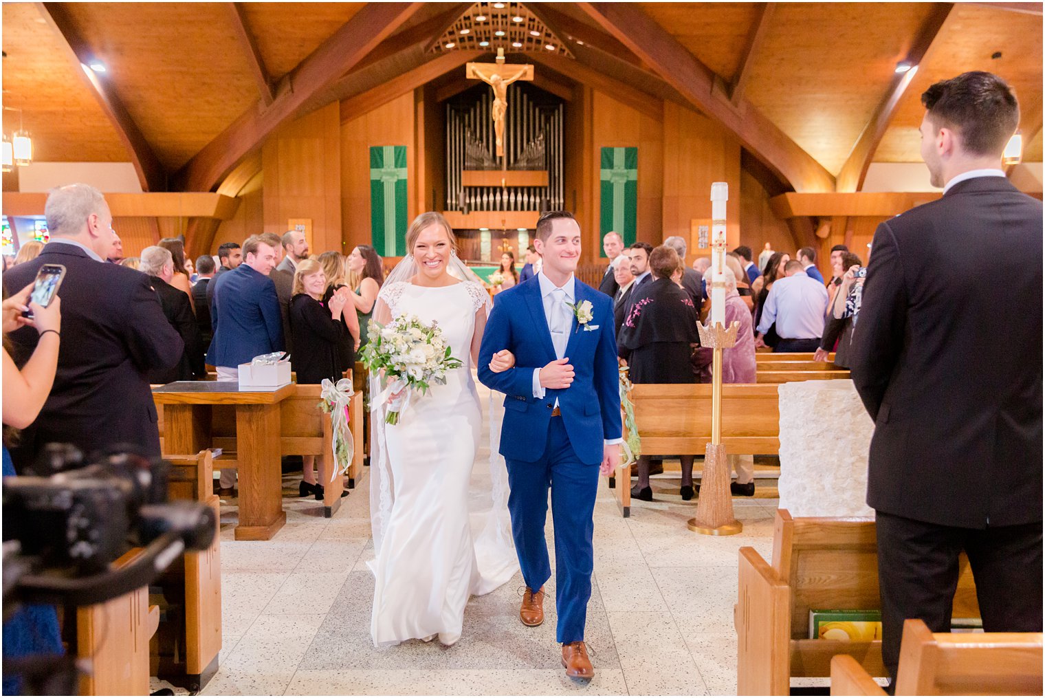 bride and groom leave church in New York on wedding day