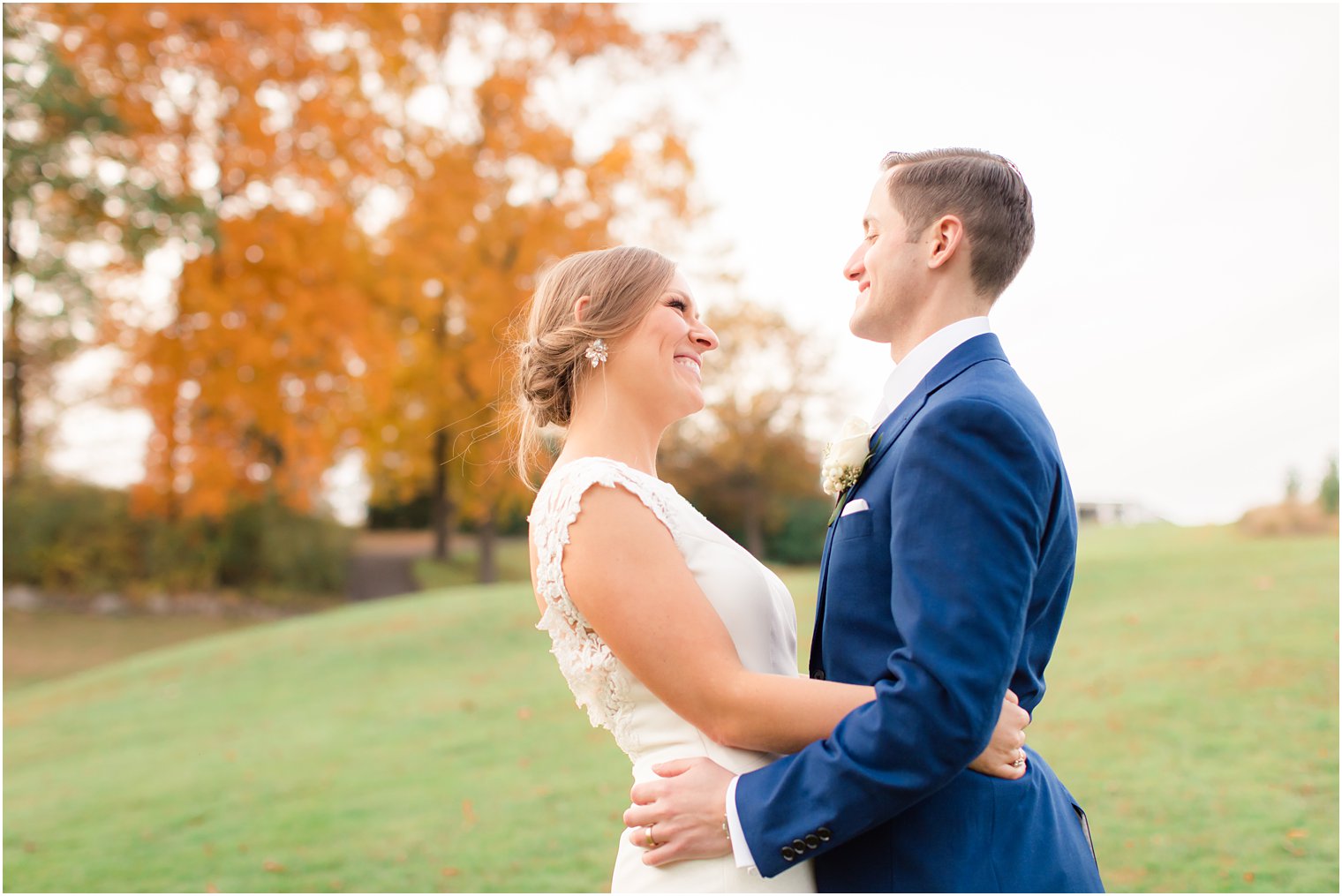 newlyweds pose at New York Country Club with Idalia Photography