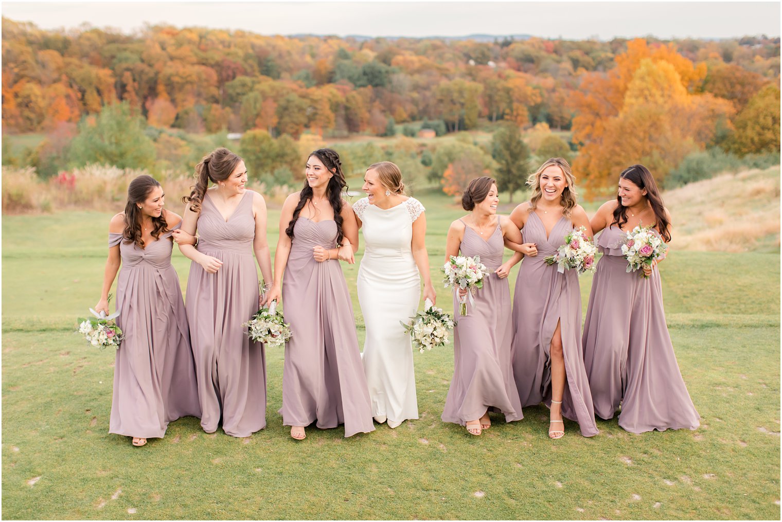 bride with bridesmaids at New York Country Club photographed by Idalia Photography