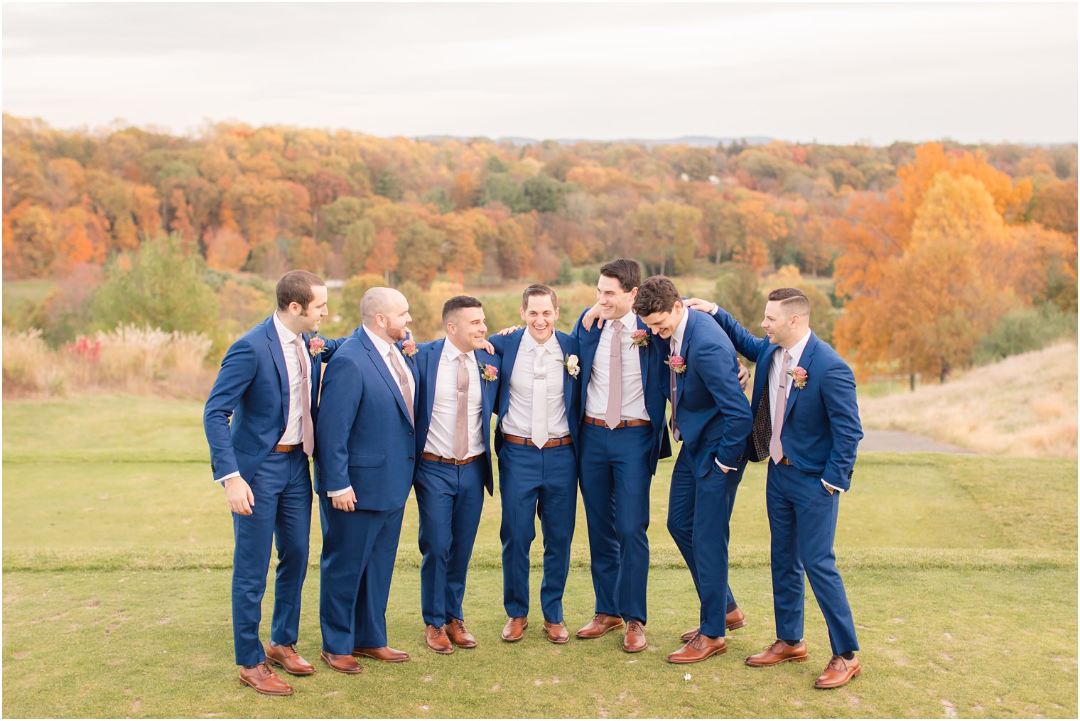 groomsmen laugh during photos with Idalia Photography