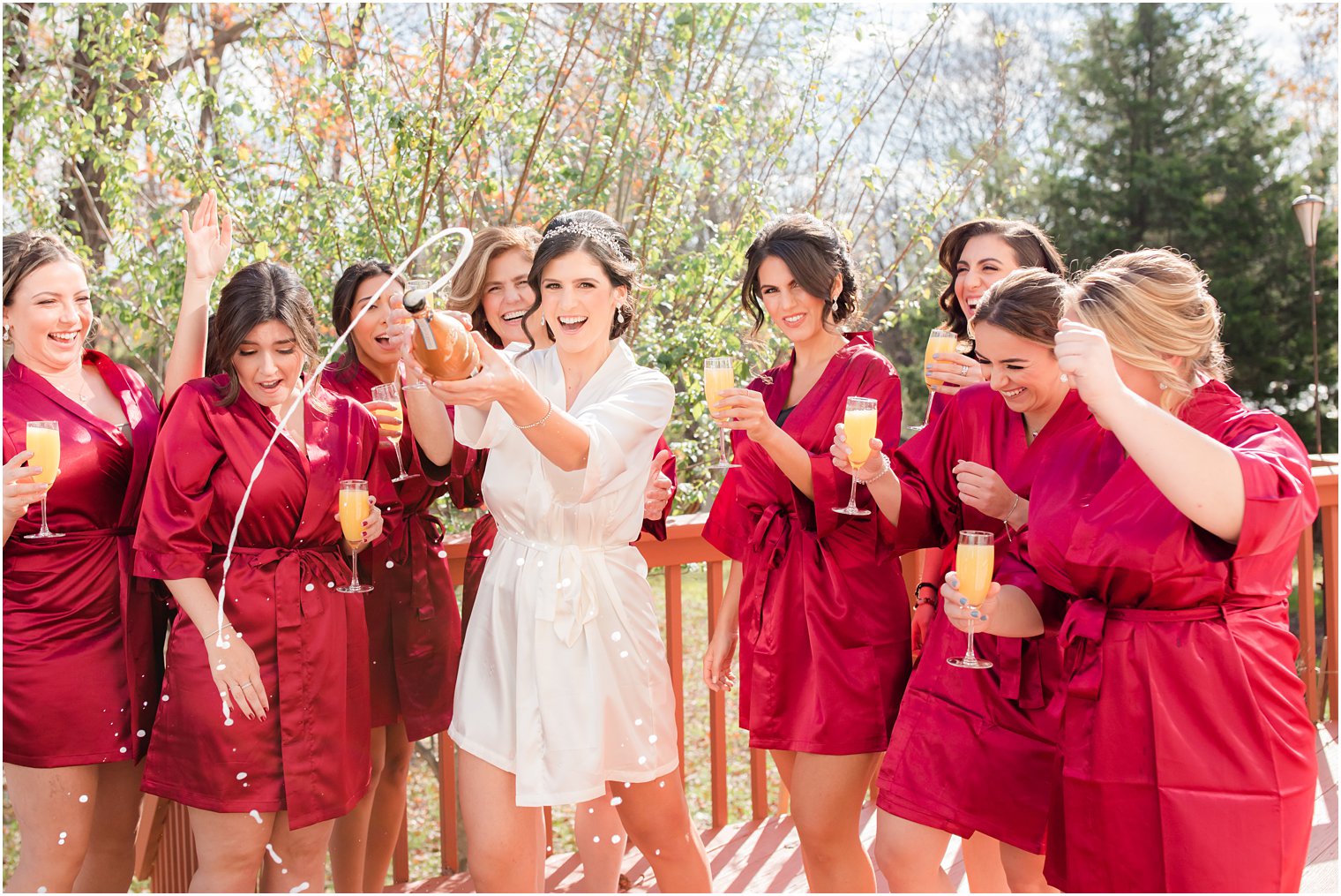 bride and bridesmaids toast wedding morning